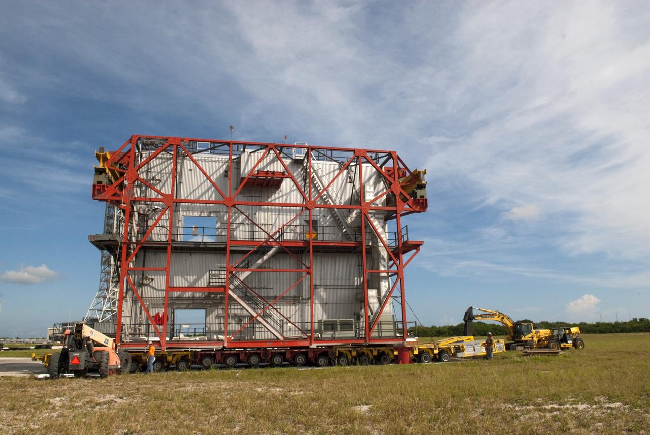 CAPE CANAVERAL, Fla. – At NASA’s Kennedy Space Center in Florida, construction workers have removed a space shuttle-era work platform from high bay 3 inside the Vehicle Assembly Building, or VAB. The platform has been moved to the VAB north parking area for temporary storage.    The work is part of a centerwide refurbishment initiative under the Ground Systems Development and Operations, or GSDO, Program. High bay 3 is being refurbished to accommodate NASA’s Space Launch System and a variety of other spacecraft.  For more information, visit http://www.nasa.gov/exploration/systems/ground/index.html. Photo credit: NASA/Charisse Nahser