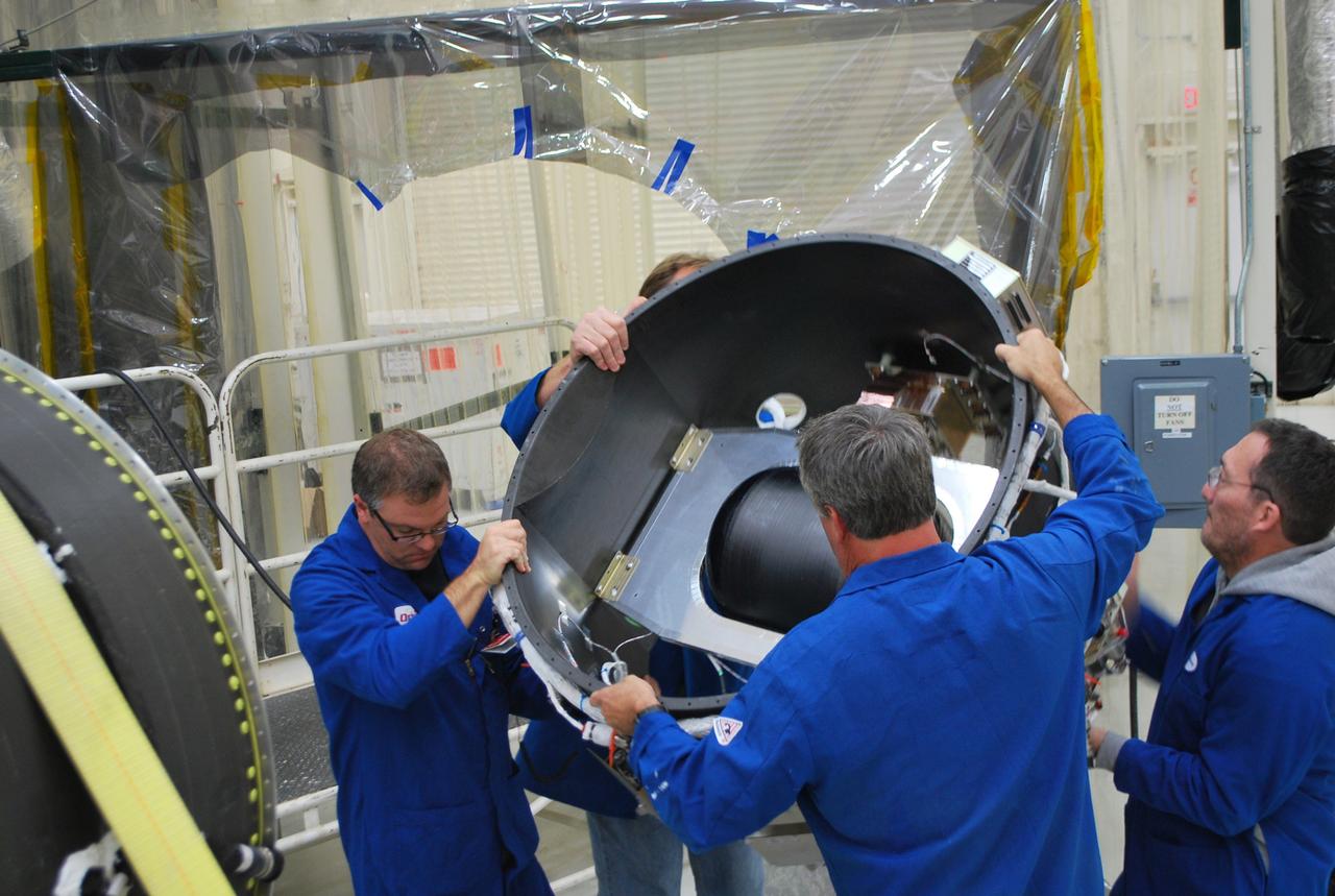 Vandenberg Air Force Base, Calif. – At Vandenberg Air Force Base in California, technicians install the avionics shelf on the third stage of the Orbital Sciences Corp. Pegasus XL rocket which will launch the Interface Region Imaging Spectrograph, or IRIS, spacecraft.      Scheduled for launch from Vandenberg Air Force Base no earlier than Feb. 27, 2013, IRIS will open a new window of discovery by tracing the flow of energy and plasma through the chromospheres and transition region into the sun’s corona using spectrometry and imaging. IRIS fills a crucial gap in our ability to advance studies of the sun-to-Earth connection by tracing the flow of energy and plasma through the foundation of the corona and the region around the sun known as the heliosphere. For more information, visit http://iris.gsfc.nasa.gov Photo credit: NASA/Randy Beaudoin