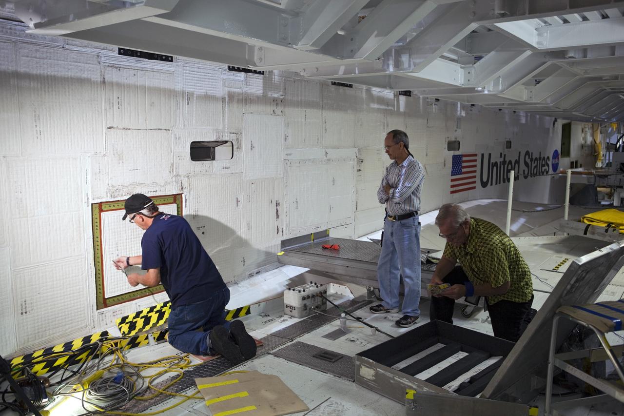 CAPE CANAVERAL, Fla. – Inside Orbiter Processing Facility-2 at NASA’s Kennedy Space Center in Florida, United Space Alliance technicians close space shuttle Atlantis’ aft doors for the final time.    The orbiter is undergoing final preparations for its transfer to the Kennedy Space Center Visitor complex targeted for November. The work is part of Transition and Retirement of the remaining shuttle. Atlantis is being prepared for public display at the visitor complex. Over the course of its 26-year career, Atlantis spent 293 days in space during 33 missions. For more information, visit http://www.nasa.gov/transition. Photo credit: NASA/Dimitri Gerondidakis