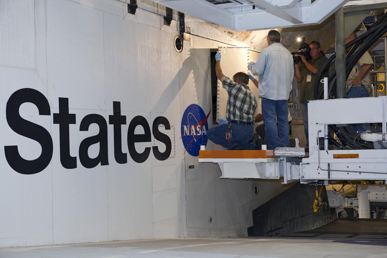 CAPE CANAVERAL, Fla. – Inside Orbiter Processing Facility-2 at NASA’s Kennedy Space Center in Florida, United Space Alliance technicians close space shuttle Atlantis’ aft doors for the final time.    The orbiter is undergoing final preparations for its transfer to the Kennedy Space Center Visitor complex targeted for November. The work is part of Transition and Retirement of the remaining shuttle. Atlantis is being prepared for public display at the visitor complex. Over the course of its 26-year career, Atlantis spent 293 days in space during 33 missions. For more information, visit http://www.nasa.gov/transition. Photo credit: NASA/Dimitri Gerondidakis