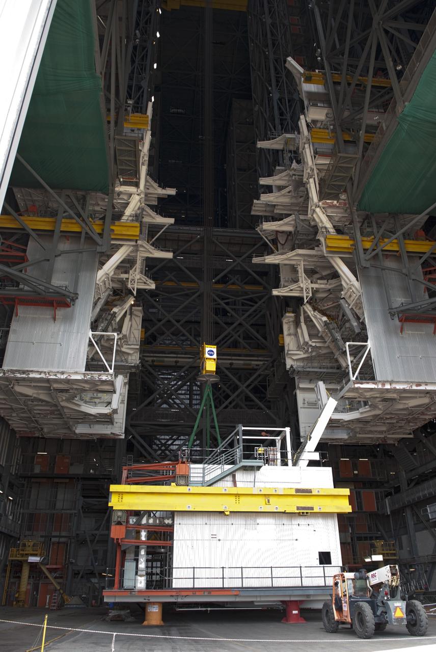 CAPE CANAVERAL, Fla. – As part of NASA's Ground Systems Development and Operations Program at the Kennedy Space Center in Florida, a large space shuttle-era work platform is being removed from high bay 3 of the Vehicle Assembly Building, or VAB. The work is part of a center-wide modernization and refurbishment initiative to accommodate NASA’s Space Launch System and a variety of other spacecraft instead of the whole building supporting one design. The Ground Systems Development and Operations Program is developing the necessary ground systems, infrastructure and operational approaches required to safely process, assemble, transport and launch the next generation of rockets and spacecraft in support of NASA’s exploration objectives. Future work also will replace the antiquated communications, power and vehicle access resources with modern efficient systems. Some of the utilities and systems slated for replacement have been used since the VAB opened in 1965. For more information, visit http://www.nasa.gov/exploration/systems/ground/index.html Photo credit: NASA/ Charisse Nahser