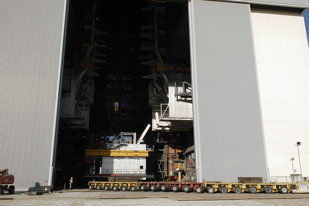 CAPE CANAVERAL, Fla. – As part of NASA's Ground Systems Development and Operations Program at the Kennedy Space Center in Florida, a large space shuttle-era work platform is being removed from high bay 3 of the Vehicle Assembly Building, or VAB, and placed on a transporter for removal. The work is part of a center-wide modernization and refurbishment initiative to accommodate NASA’s Space Launch System and a variety of other spacecraft instead of the whole building supporting one design. The Ground Systems Development and Operations Program is developing the necessary ground systems, infrastructure and operational approaches required to safely process, assemble, transport and launch the next generation of rockets and spacecraft in support of NASA’s exploration objectives. Future work also will replace the antiquated communications, power and vehicle access resources with modern efficient systems. Some of the utilities and systems slated for replacement have been used since the VAB opened in 1965. For more information, visit http://www.nasa.gov/exploration/systems/ground/index.html Photo credit: NASA/ Charisse Nahser