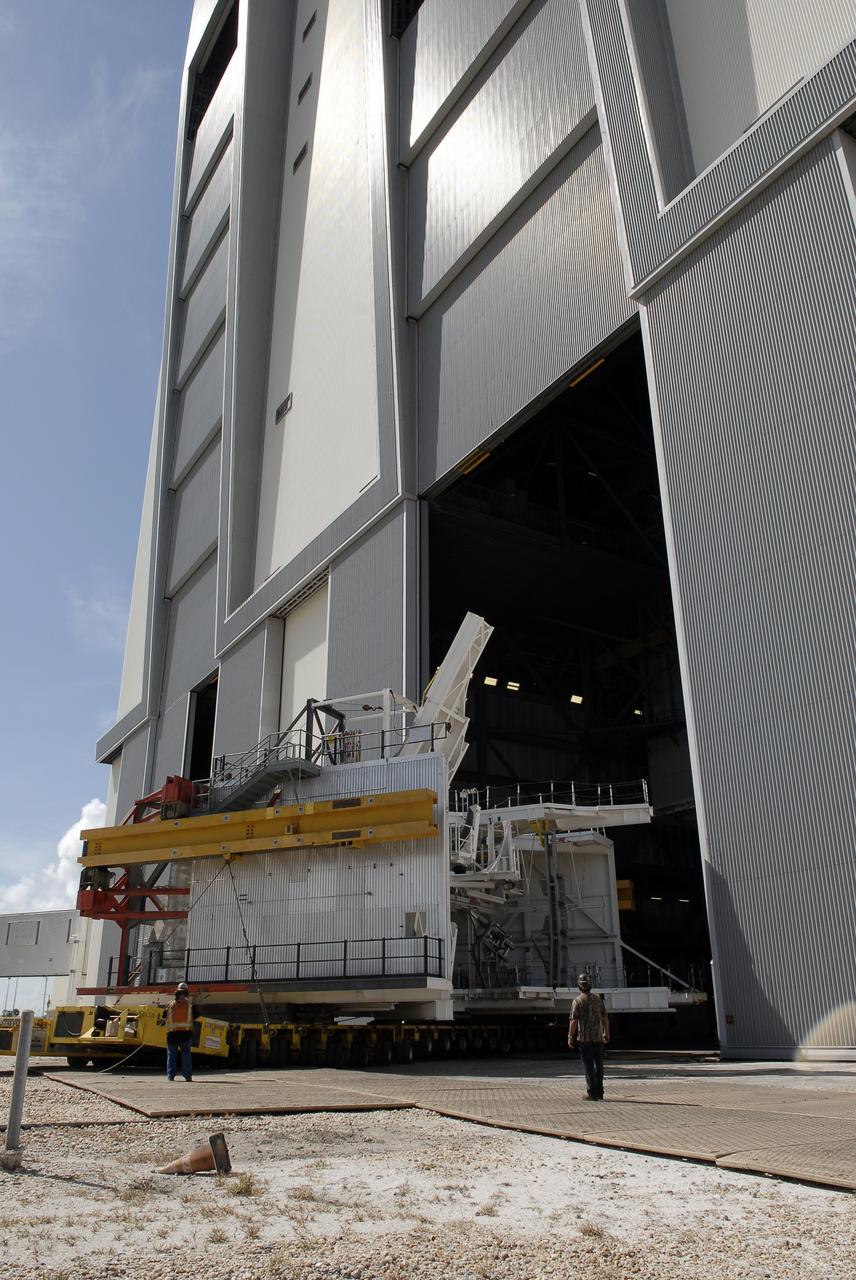 CAPE CANAVERAL, Fla. – As part of NASA's Ground Systems Development and Operations Program at the Kennedy Space Center in Florida, technicians oversee a large space shuttle-era work platform being removed from high bay 3 of the Vehicle Assembly Building, or VAB. The work is part of a center-wide modernization and refurbishment initiative to accommodate NASA’s Space Launch System and a variety of other spacecraft instead of the whole building supporting one design. The Ground Systems Development and Operations Program is developing the necessary ground systems, infrastructure and operational approaches required to safely process, assemble, transport and launch the next generation of rockets and spacecraft in support of NASA’s exploration objectives. Future work also will replace the antiquated communications, power and vehicle access resources with modern efficient systems. Some of the utilities and systems slated for replacement have been used since the VAB opened in 1965. For more information, visit http://www.nasa.gov/exploration/systems/ground/index.html Photo credit: NASA/ Charisse Nahser