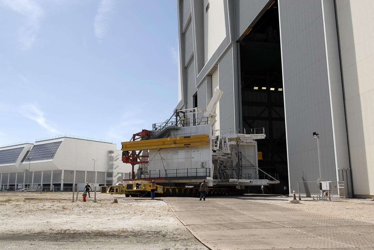 CAPE CANAVERAL, Fla. – As part of NASA's Ground Systems Development and Operations Program at the Kennedy Space Center in Florida, technicians oversee a large space shuttle-era work platform being removed from high bay 3 of the Vehicle Assembly Building, or VAB. The work is part of a center-wide modernization and refurbishment initiative to accommodate NASA’s Space Launch System and a variety of other spacecraft instead of the whole building supporting one design. The Ground Systems Development and Operations Program is developing the necessary ground systems, infrastructure and operational approaches required to safely process, assemble, transport and launch the next generation of rockets and spacecraft in support of NASA’s exploration objectives. Future work also will replace the antiquated communications, power and vehicle access resources with modern efficient systems. Some of the utilities and systems slated for replacement have been used since the VAB opened in 1965. For more information, visit http://www.nasa.gov/exploration/systems/ground/index.html Photo credit: NASA/ Charisse Nahser
