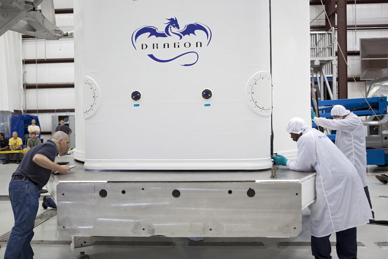 CAPE CANAVERAL, Fla. - Space Exploration Technologies, or SpaceX, technicians inspect a Dragon spacecraft being prepared for the company's first Commercial Resupply Services, or CRS-1, mission to the International Space Station. The capsule is scheduled to lift off from on Oct. 7, 2012 Space Launch Complex 40 at Cape Canaveral Air Force Station in Florida aboard a Falcon 9 rocket. The mission will be the company's second demonstration test flight for NASA's Commercial Orbital Transportation Services Program, or COTS. The SpaceX CRS contract with NASA provides for 12 cargo resupply missions to the station through 2015, the first of which is targeted to launch in October 2012.SpaceX became the first private company to berth a spacecraft with the space station in 2012 during its final demonstration flight under the Commercial Orbital Transportation Services, or COTS, program managed by NASA's Johnson Space Center in Houston. For more information, visit http://www.nasa.gov/mission_pages/station/living/launch/index.htmlPhoto credit: NASA/Ben Smegelsky