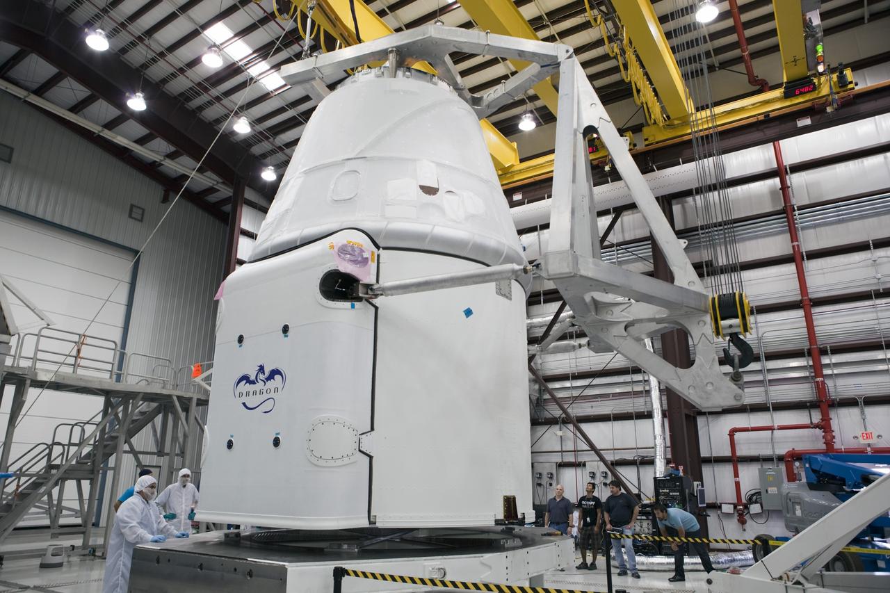 CAPE CANAVERAL, Fla. - Space Exploration Technologies, or SpaceX, technicians inspect a Dragon spacecraft being prepared for the company's first Commercial Resupply Services, or CRS-1, mission to the International Space Station. The capsule is scheduled to lift off on Oct. 7, 2012 from Space Launch Complex 40 at Cape Canaveral Air Force Station in Florida aboard a Falcon 9 rocket. The mission will be the company's second demonstration test flight for NASA's Commercial Orbital Transportation Services Program, or COTS. The SpaceX CRS contract with NASA provides for 12 cargo resupply missions to the station through 2015, the first of which is targeted to launch in October 2012.SpaceX became the first private company to berth a spacecraft with the space station in 2012 during its final demonstration flight under the Commercial Orbital Transportation Services, or COTS, program managed by NASA's Johnson Space Center in Houston. For more information, visit http://www.nasa.gov/mission_pages/station/living/launch/index.htmlPhoto credit: NASA/Ben Smegelsky