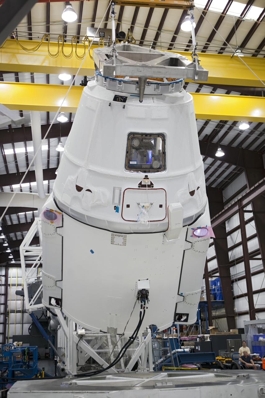 CAPE CANAVERAL, Fla. - A Space Exploration Technologies, or SpaceX, Dragon spacecraft is rotated for mating with its Falcon 9 launch vehicle. The rocket is being prepared for the company's first Commercial Resupply Services, or CRS-1, mission to the International Space Station. The capsule is scheduled to lift off on Oct. 7, 2012 from Space Launch Complex 40 at Cape Canaveral Air Force Station in Florida aboard a Falcon 9 rocket. The mission will be the company's second demonstration test flight for NASA's Commercial Orbital Transportation Services Program, or COTS. The SpaceX CRS contract with NASA provides for 12 cargo resupply missions to the station through 2015, the first of which is targeted to launch in October 2012.SpaceX became the first private company to berth a spacecraft with the space station in 2012 during its final demonstration flight under the Commercial Orbital Transportation Services, or COTS, program managed by NASA's Johnson Space Center in Houston. For more information, visit http://www.nasa.gov/mission_pages/station/living/launch/index.htmlPhoto credit: NASA/Ben Smegelsky