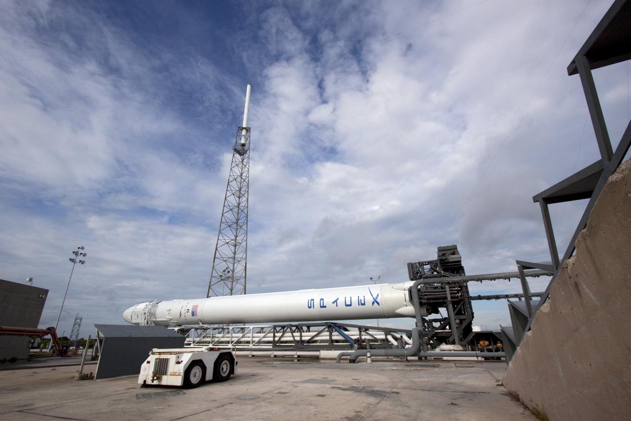 CAPE CANAVERAL, Fla. -- The Space Exploration Technologies Corp., or SpaceX, Falcon 9 rocket with Dragon capsule attached on top continues along on a rollout demonstration test to Space Launch Complex-40 at Cape Canaveral Air Force Station in Florida. Preparations continue for NASA’s first Commercial Resupply Services, or CRS-1, mission to the International Space Station.    The rollout to the pad for liftoff is planned for Sunday morning, Oct. 7. Liftoff from CCAFS is scheduled during an instantaneous window at 8:35 p.m. EDT Sunday evening. SpaceX CRS-1 is an important step toward making America’s microgravity research program self-sufficient by providing a way to deliver and return significant amounts of cargo, including science experiments, to and from the orbiting laboratory. To learn more, visit http://www.nasa.gov/mission_pages/station/living/launch/index.html. Photo credit: NASA/Jim Grossmann