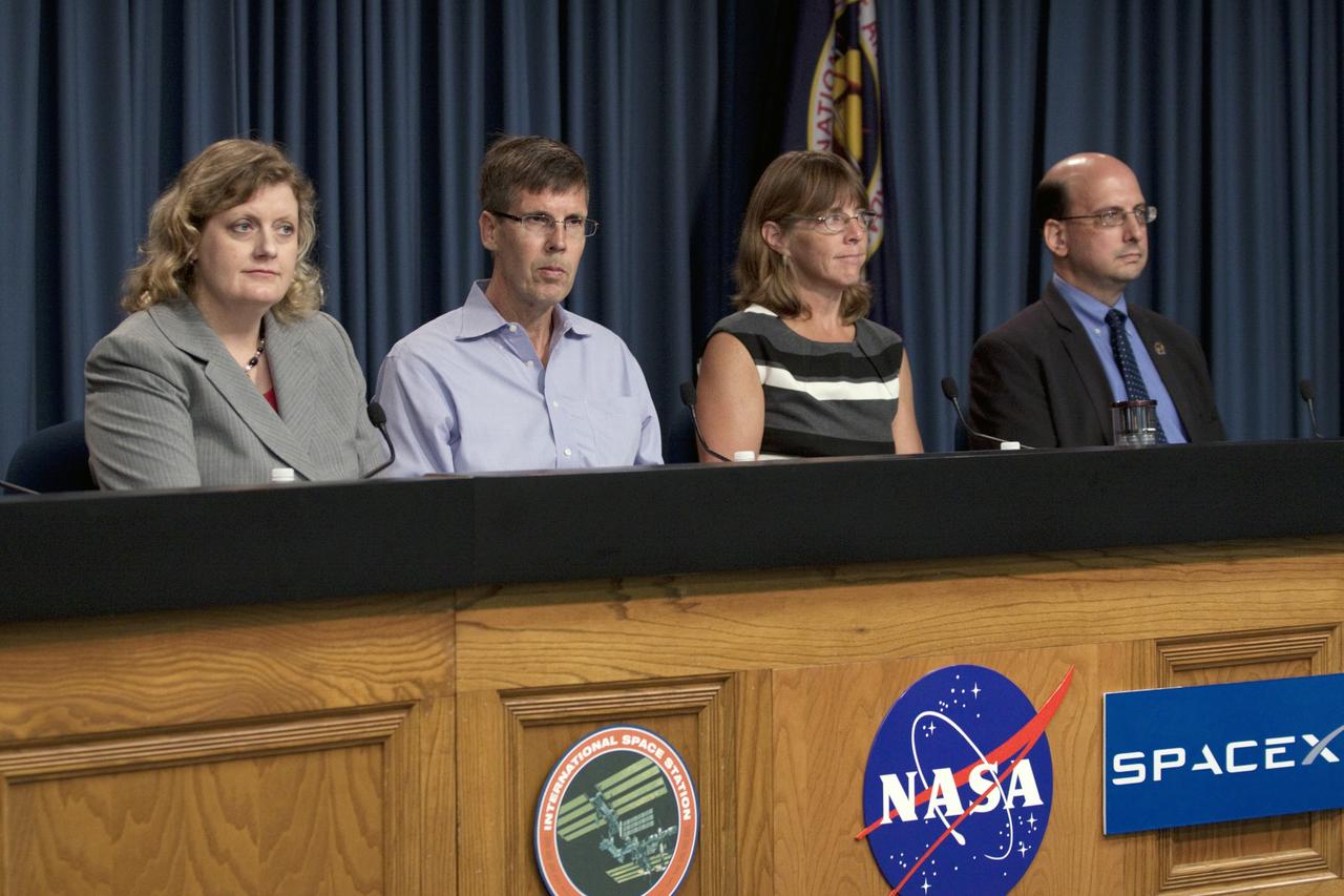 CAPE CANAVERAL, Fla. -- Scientists participate in a space station and mission science briefing in NASA Kennedy Space Center's Press Site auditorium in Florida. From left are Julie Robinson, program scientist for International Space Station at NASA's Johnson Space Center, Timothy Yeatman, interim chief scientist at the Center for the Advancement of Science in Space, Sheila Nielsen-Preiss, cell biologist at Montana State University, and Scott Smith, NASA nutritionist at NASA's Johnson Space Center.       The briefing provided media with an overview of the experiments and payloads scheduled for launch on NASA's first Commercial Resupply Services, or CRS-1, mission to the International Space Station. Space Exploration Technologies Corp., or SpaceX, built both the mission's Falcon 9 rocket and Dragon capsule. Launch is scheduled for 8:35 p.m. EDT on Oct. 7 from Space Launch Complex 40 on Cape Canaveral Air Force Station.  SpaceX CRS-1 is an important step toward making America’s microgravity research program self-sufficient by providing a way to deliver and return significant amounts of cargo, including science experiments, to and from the orbiting laboratory. NASA has contracted for 12 commercial resupply flights from SpaceX and eight from the Orbital Sciences Corp. For more information, visit http://www.nasa.gov/mission_pages/station/living/launch/index.html.  Photo credit: NASA/Kim Shiflett