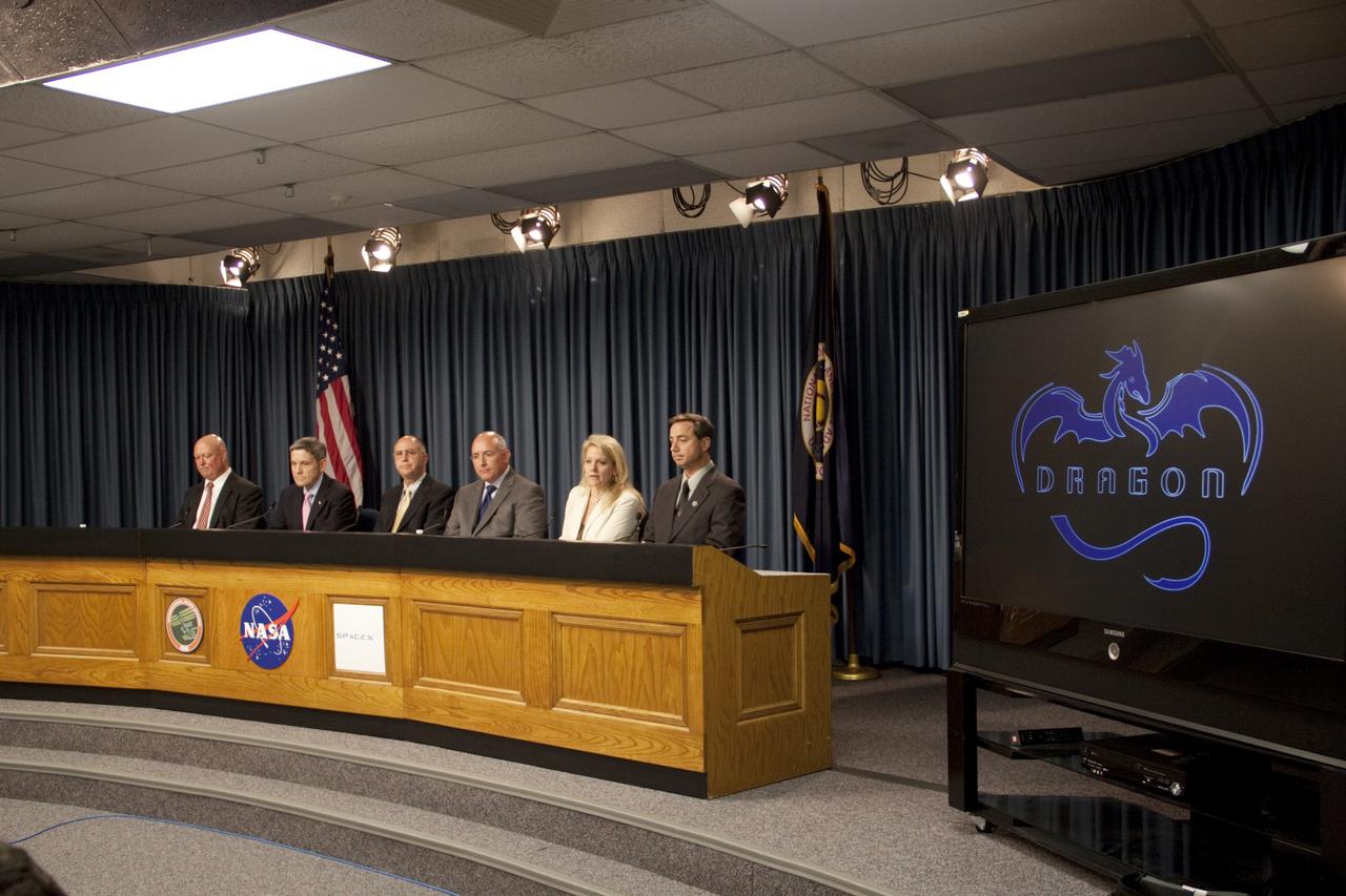 CAPE CANAVERAL, Fla. -- A prelaunch news conference is held in NASA Kennedy Space Center's Press Site auditorium in Florida. From left are Michael Curie, NASA Public Affairs, Bob Cabana, director of NASA Kennedy Space Center, Sam Scimemi, director of International Space Station at NASA Headquarters, Mike Suffredini, program manager of International Space Station at NASA Johnson Space Center, Gwynne Shotwell, president of Space Exploration Technologies Corp., or SpaceX, and Mike McAleenan, launch weather officer from the 45th Weather Squadron at Cape Canaveral Air Force Station.  The news conference provided the media with a status on the readiness to launch NASA's first Commercial Resupply Services, or CRS-1, mission to the International Space Station. Space Exploration Technologies Corp., or SpaceX, built both the mission's Falcon 9 rocket and Dragon capsule. Launch is scheduled for 8:35 p.m. EDT on Oct. 7 from Space Launch Complex 40 on Cape Canaveral Air Force Station.  SpaceX CRS-1 is an important step toward making America’s microgravity research program self-sufficient by providing a way to deliver and return significant amounts of cargo, including science experiments, to and from the orbiting laboratory. NASA has contracted for 12 commercial resupply flights from SpaceX and eight from the Orbital Sciences Corp. For more information, visit http://www.nasa.gov/mission_pages/station/living/launch/index.html.  Photo credit: NASA/Jim Grossmann