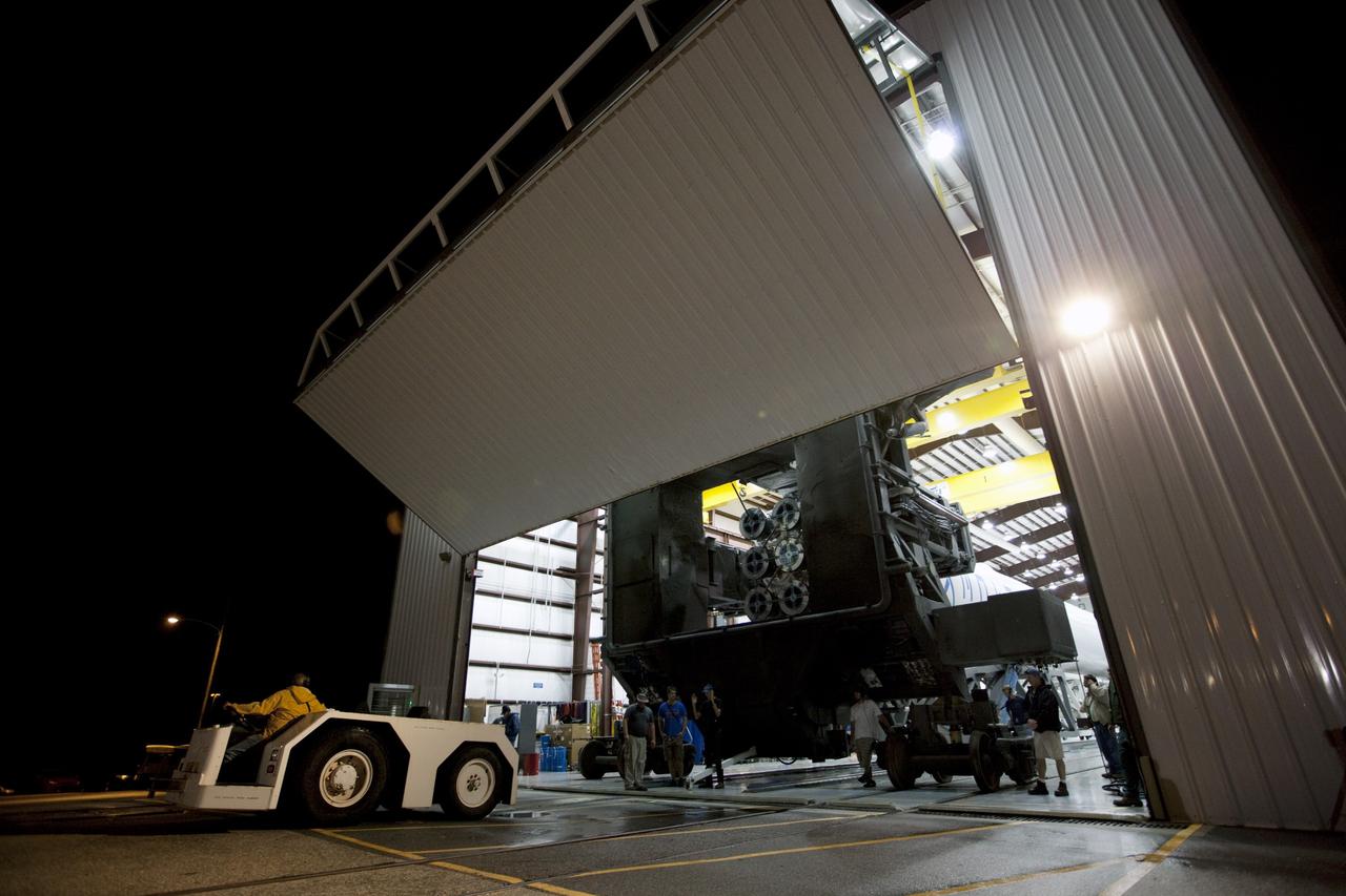 CAPE CANAVERAL, Fla. -- Preparations are under way to roll a Falcon 9 rocket with a Dragon capsule secured atop from the processing hangar to the pad at Space Launch Complex 40 on Cape Canaveral Air Force Station in Florida.      Space Exploration Technologies Corp., or SpaceX, built both the rocket and capsule for NASA's first Commercial Resupply Services, or CRS-1, mission to the International Space Station.  Rollout was complete at 9:55 p.m. EDT.  SpaceX CRS-1 is an important step toward making America’s microgravity research program self-sufficient by providing a way to deliver and return significant amounts of cargo, including science experiments, to and from the orbiting laboratory. Launch is scheduled for 8:35 p.m. EDT on Oct. 7. NASA has contracted for 12 commercial resupply flights from SpaceX and eight from the Orbital Sciences Corp. For more information, visit http://www.nasa.gov/mission_pages/station/living/launch/index.html.  Photo credit: NASA/Kim Shiflett