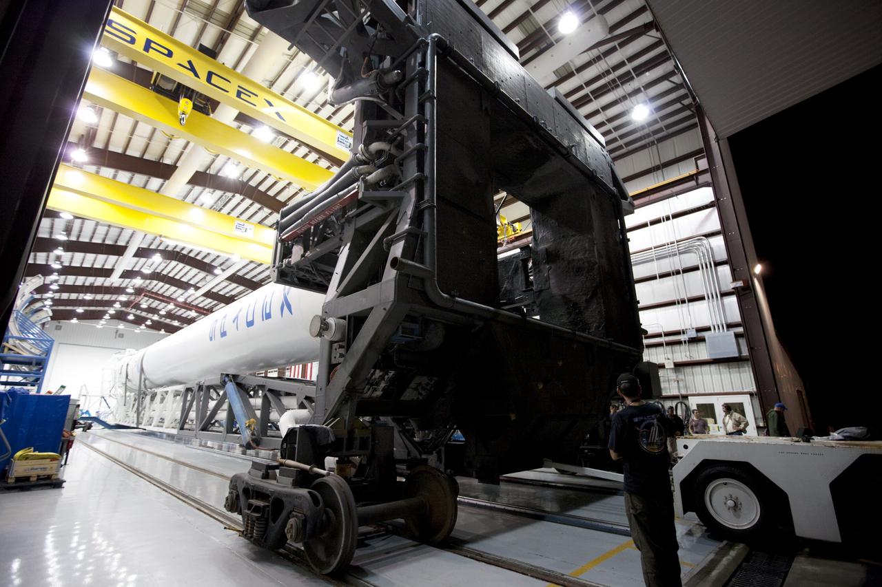 CAPE CANAVERAL, Fla. -- Preparations are under way to roll a Falcon 9 rocket with a Dragon capsule secured atop from the processing hangar to the pad at Space Launch Complex 40 on Cape Canaveral Air Force Station in Florida.      Space Exploration Technologies Corp., or SpaceX, built both the rocket and capsule for NASA's first Commercial Resupply Services, or CRS-1, mission to the International Space Station.  Rollout was complete at 9:55 p.m. EDT.  SpaceX CRS-1 is an important step toward making America’s microgravity research program self-sufficient by providing a way to deliver and return significant amounts of cargo, including science experiments, to and from the orbiting laboratory. Launch is scheduled for 8:35 p.m. EDT on Oct. 7. NASA has contracted for 12 commercial resupply flights from SpaceX and eight from the Orbital Sciences Corp. For more information, visit http://www.nasa.gov/mission_pages/station/living/launch/index.html.  Photo credit: NASA/Kim Shiflett