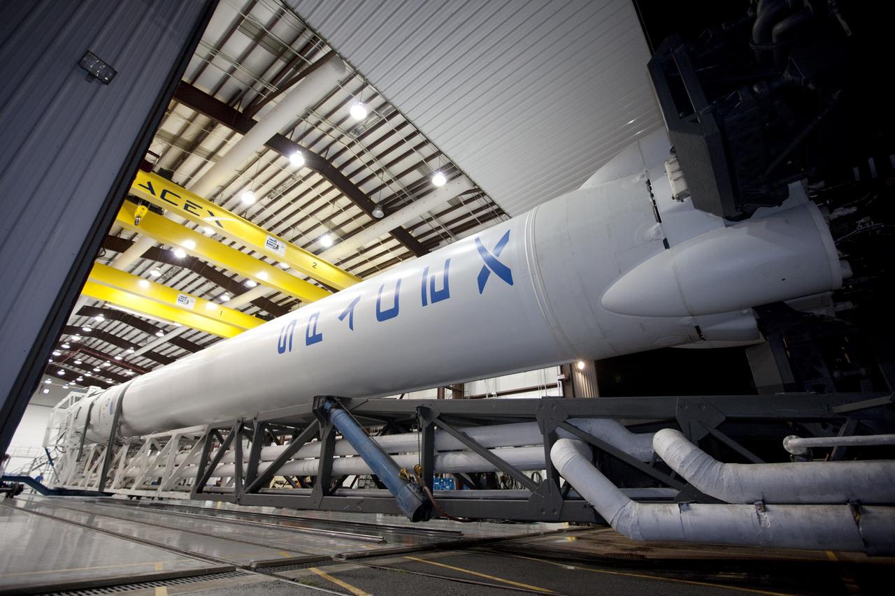 CAPE CANAVERAL, Fla. -- A Falcon 9 rocket with a Dragon capsule secured atop begins to roll from the processing hangar to the pad at Space Launch Complex 40 on Cape Canaveral Air Force Station in Florida.      Space Exploration Technologies Corp., or SpaceX, built both the rocket and capsule for NASA's first Commercial Resupply Services, or CRS-1, mission to the International Space Station.  Rollout was complete at 9:55 p.m. EDT.  SpaceX CRS-1 is an important step toward making America’s microgravity research program self-sufficient by providing a way to deliver and return significant amounts of cargo, including science experiments, to and from the orbiting laboratory. Launch is scheduled for 8:35 p.m. EDT on Oct. 7. NASA has contracted for 12 commercial resupply flights from SpaceX and eight from the Orbital Sciences Corp. For more information, visit http://www.nasa.gov/mission_pages/station/living/launch/index.html.  Photo credit: NASA/Kim Shiflett