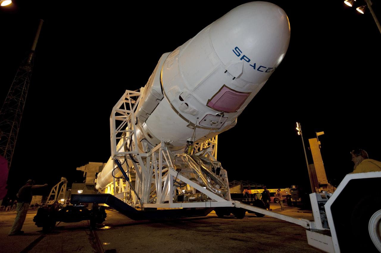 CAPE CANAVERAL, Fla. -- A Falcon 9 rocket with a Dragon capsule secured atop makes slow, steady progress as it rolls from the processing hangar to the pad at Space Launch Complex 40 on Cape Canaveral Air Force Station in Florida.      Space Exploration Technologies Corp., or SpaceX, built both the rocket and capsule for NASA's first Commercial Resupply Services, or CRS-1, mission to the International Space Station.  Rollout was complete at 9:55 p.m. EDT.  SpaceX CRS-1 is an important step toward making America’s microgravity research program self-sufficient by providing a way to deliver and return significant amounts of cargo, including science experiments, to and from the orbiting laboratory. Launch is scheduled for 8:35 p.m. EDT on Oct. 7. NASA has contracted for 12 commercial resupply flights from SpaceX and eight from the Orbital Sciences Corp. For more information, visit http://www.nasa.gov/mission_pages/station/living/launch/index.html.  Photo credit: NASA/Kim Shiflett