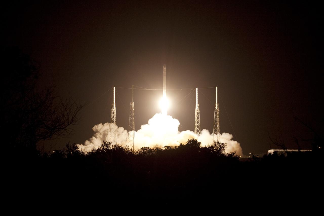 CAPE CANAVERAL, Fla. -- A rumble is heard across the Space Coast as a Falcon 9 rocket lifts off Space Launch Complex 40 on Cape Canaveral Air Force Station in Florida at 8:35 p.m. EDT, carrying a Dragon capsule to orbit.    Space Exploration Technologies Corp., or SpaceX, built both the rocket and capsule for NASA's first Commercial Resupply Services, or CRS-1, mission to the International Space Station. SpaceX CRS-1 is an important step toward making America’s microgravity research program self-sufficient by providing a way to deliver and return significant amounts of cargo, including science experiments, to and from the orbiting laboratory. NASA has contracted for 12 commercial resupply flights from SpaceX and eight from the Orbital Sciences Corp. For more information, visit http://www.nasa.gov/mission_pages/station/living/launch/index.html.  Photo credit: NASA/Jim Grossmann