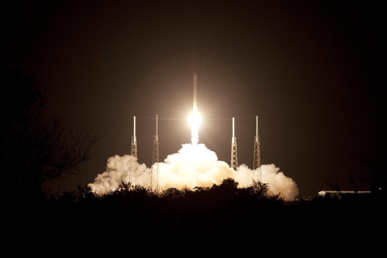 CAPE CANAVERAL, Fla. -- A Dragon capsule begins its journey to orbit atop a Falcon 9 rocket at 8:35 p.m. EDT from Space Launch Complex 40 on Cape Canaveral Air Force Station in Florida.     Space Exploration Technologies Corp., or SpaceX, built both the rocket and capsule for NASA's first Commercial Resupply Services, or CRS-1, mission to the International Space Station. SpaceX CRS-1 is an important step toward making America’s microgravity research program self-sufficient by providing a way to deliver and return significant amounts of cargo, including science experiments, to and from the orbiting laboratory. NASA has contracted for 12 commercial resupply flights from SpaceX and eight from the Orbital Sciences Corp. For more information, visit http://www.nasa.gov/mission_pages/station/living/launch/index.html.  Photo credit: NASA/Jim Grossmann