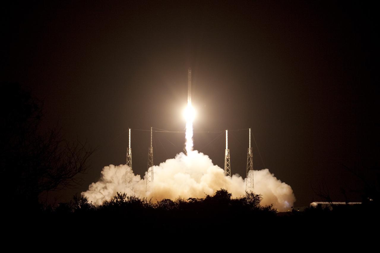 CAPE CANAVERAL, Fla. -- Space Launch Complex 40 on Cape Canaveral Air Force Station in Florida is illuminated by a Falcon 9 rocket as it lifts off at 8:35 p.m. EDT carrying a Dragon capsule to orbit. Space Exploration Technologies Corp., or SpaceX, built both the rocket and capsule for NASA's first Commercial Resupply Services, or CRS-1, mission to the International Space Station. SpaceX CRS-1 is an important step toward making America’s microgravity research program self-sufficient by providing a way to deliver and return significant amounts of cargo, including science experiments, to and from the orbiting laboratory. NASA has contracted for 12 commercial resupply flights from SpaceX and eight from the Orbital Sciences Corp. For more information, visit http://www.nasa.gov/mission_pages/station/living/launch/index.html. Photo credit: NASA/Jim Grossmann