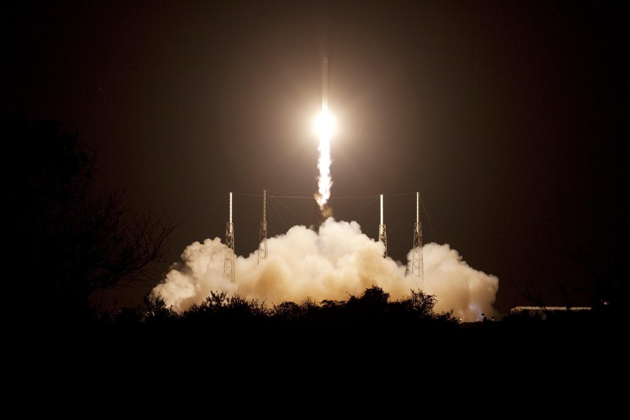 CAPE CANAVERAL, Fla. -- A Falcon 9 rocket makes its way into the clouds over Space Launch Complex 40 on Cape Canaveral Air Force Station in Florida carrying a Dragon capsule to orbit. Launch was at 8:35 p.m. EDT.    Space Exploration Technologies Corp., or SpaceX, built both the rocket and capsule for NASA's first Commercial Resupply Services, or CRS-1, mission to the International Space Station. SpaceX CRS-1 is an important step toward making America’s microgravity research program self-sufficient by providing a way to deliver and return significant amounts of cargo, including science experiments, to and from the orbiting laboratory. NASA has contracted for 12 commercial resupply flights from SpaceX and eight from the Orbital Sciences Corp. For more information, visit http://www.nasa.gov/mission_pages/station/living/launch/index.html.  Photo credit: NASA/Jim Grossmann