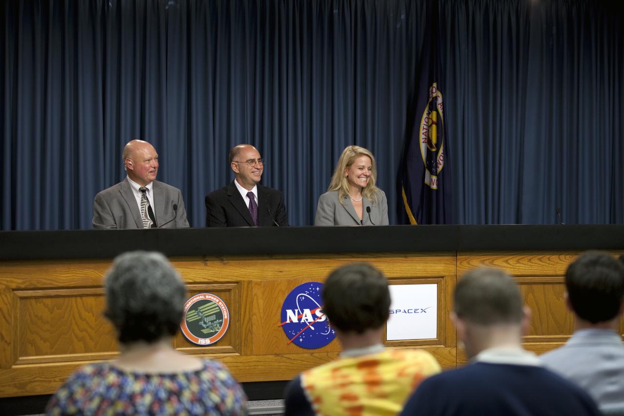 CAPE CANAVERAL, Fla. -- The participants of a post-launch news conference held in the Press Site auditorium at NASA's Kennedy Space Center in Florida are all smiles following the successful launch of NASA's first Commercial Resupply Services, or CRS-1, mission to the International Space Station. On the dais are, from left, Michael Curie, NASA Public Affairs, Sam Scimemi, director of International Space Station at NASA Headquarters, and Gwynne Shotwell, president of Space Exploration Technologies Corp., or SpaceX.     SpaceX built both the Falcon 9 rocket and Dragon capsule that launched at 8:35 p.m. EDT from Space Launch Complex 40 on Cape Canaveral Air Force Station. SpaceX CRS-1 is an important step toward making America’s microgravity research program self-sufficient by providing a way to deliver and return significant amounts of cargo, including science experiments, to and from the orbiting laboratory. NASA has contracted for 12 commercial resupply flights from SpaceX and eight from the Orbital Sciences Corp. For more information, visit http://www.nasa.gov/mission_pages/station/living/launch/index.html. Photo credit: NASA/Kim Shiflett