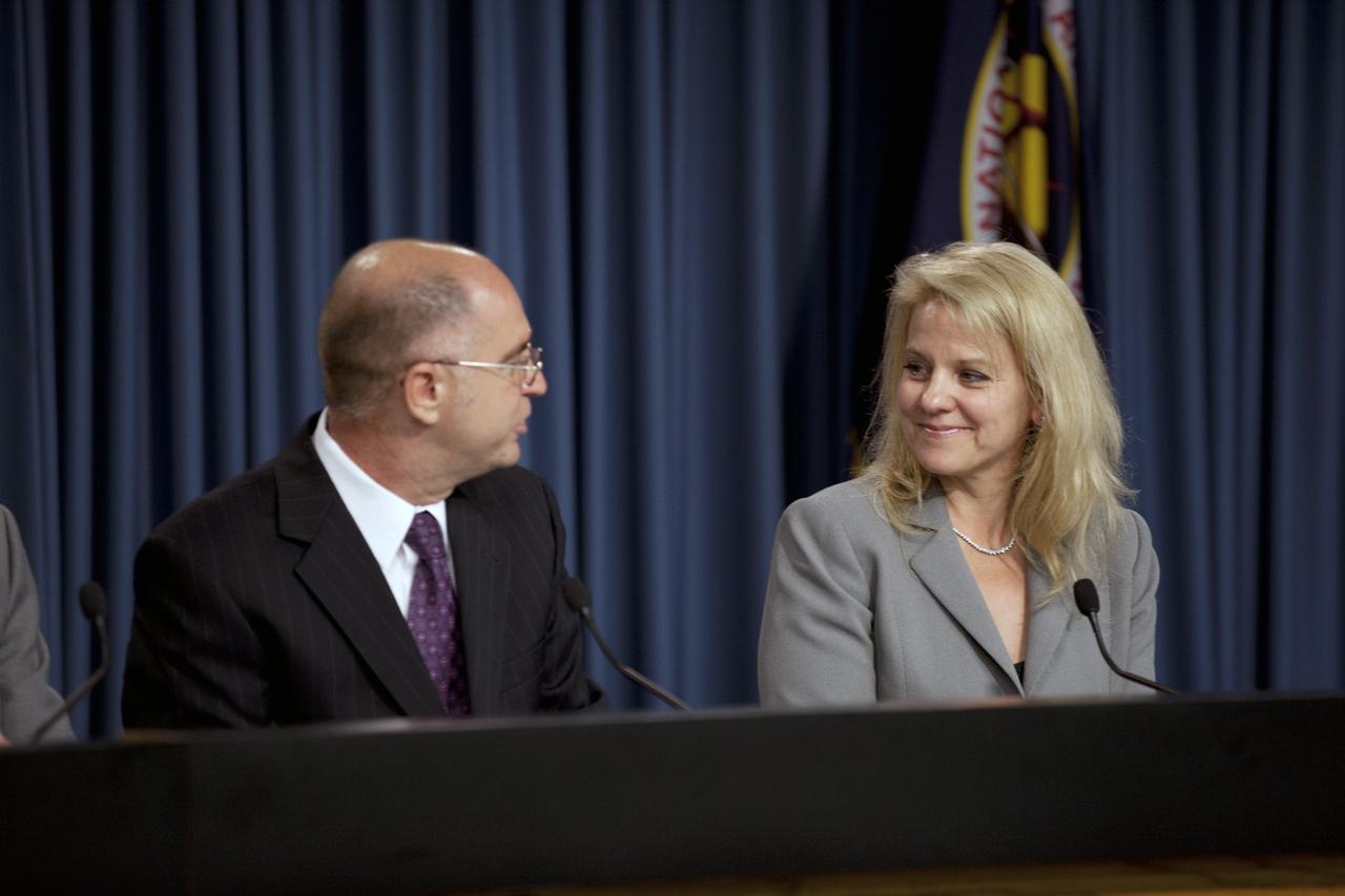 CAPE CANAVERAL, Fla. -- Sam Scimemi, at left, director of International Space Station at NASA Headquarters, congratulates Gwynne Shotwell, president of Space Exploration Technologies Corp., or SpaceX, on the successful launch of NASA's first Commercial Resupply Services, or CRS-1, mission to the International Space Station during a post-launch news conference held in the Press Site auditorium at NASA's Kennedy Space Center in Florida.    SpaceX built both the Falcon 9 rocket and Dragon capsule that launched at 8:35 p.m. EDT from Space Launch Complex 40 on Cape Canaveral Air Force Station. SpaceX CRS-1 is an important step toward making America’s microgravity research program self-sufficient by providing a way to deliver and return significant amounts of cargo, including science experiments, to and from the orbiting laboratory. NASA has contracted for 12 commercial resupply flights from SpaceX and eight from the Orbital Sciences Corp. For more information, visit http://www.nasa.gov/mission_pages/station/living/launch/index.html. Photo credit: NASA/Kim Shiflett