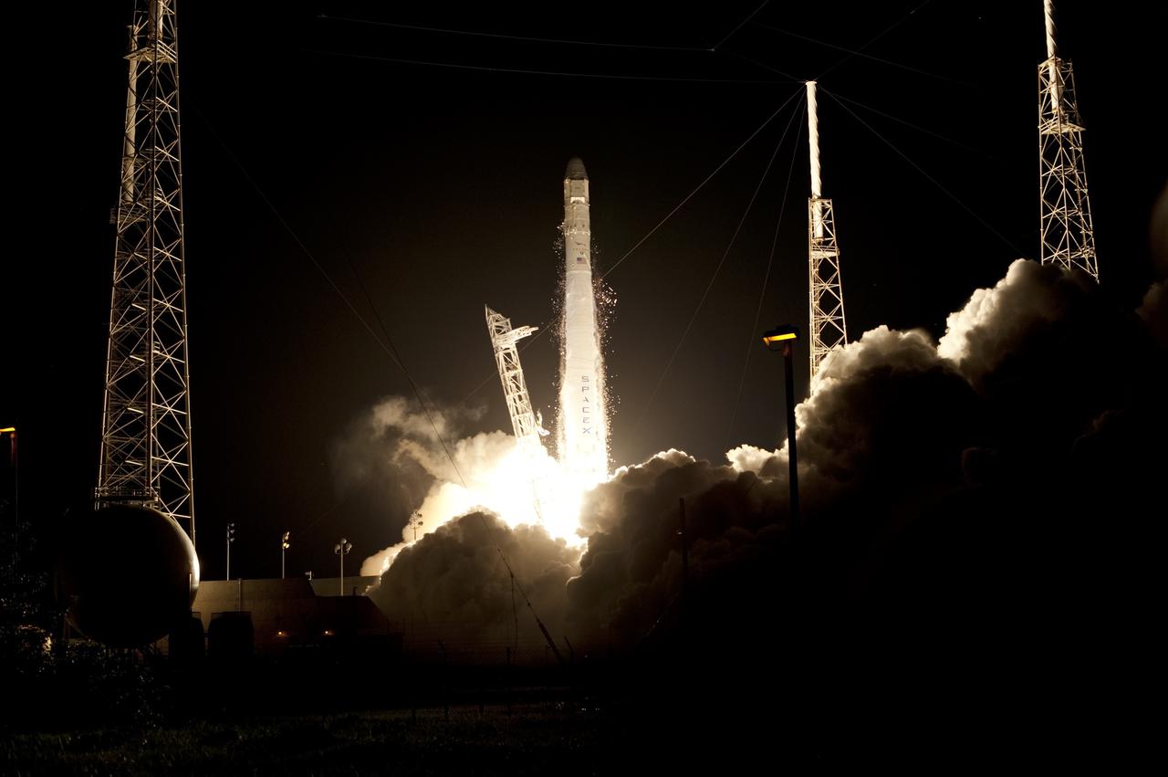 CAPE CANAVERAL, Fla. -- A Falcon 9 rocket roars to life on Space Launch Complex 40 on Cape Canaveral Air Force Station in Florida at 8:35 p.m. EDT, carrying a Dragon capsule to orbit.      Space Exploration Technologies Corp., or SpaceX, built both the rocket and capsule for NASA's first Commercial Resupply Services, or CRS-1, mission to the International Space Station. SpaceX CRS-1 is an important step toward making America’s microgravity research program self-sufficient by providing a way to deliver and return significant amounts of cargo, including science experiments, to and from the orbiting laboratory. NASA has contracted for 12 commercial resupply flights from SpaceX and eight from the Orbital Sciences Corp. For more information, visit http://www.nasa.gov/mission_pages/station/living/launch/index.html.  Photo credit: NASA/Tony Gray and Rick Wetherington