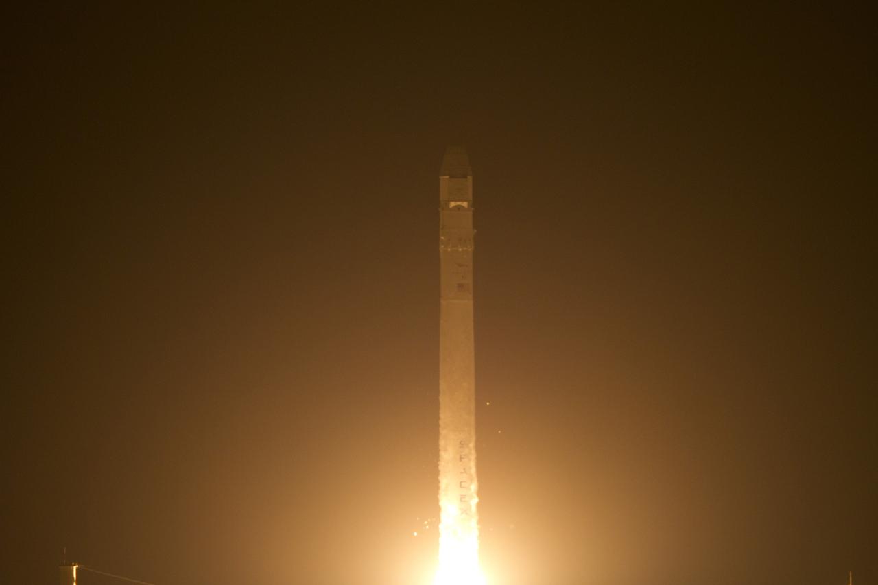 CAPE CANAVERAL, Fla. - At Space Launch Complex 40 on Cape Canaveral Air Force Station in Florida a Falcon 9 rocket carrying a Dragon capsule lifts off at 8:35 p.m. EDT. Space Exploration Technologies Corp., or SpaceX, built both the rocket and capsule for NASA's first Commercial Resupply Services, or CRS-1, mission to the International Space Station.      SpaceX CRS-1 is an important step toward making America’s microgravity research program self-sufficient by providing a way to deliver and return significant amounts of cargo, including science experiments, to and from the orbiting laboratory. NASA has contracted for 12 commercial resupply flights from SpaceX and eight from the Orbital Sciences Corp. For more information, visit http://www.nasa.gov/mission_pages/station/living/launch/index.html  Photo credit: NASA/Ken Allen