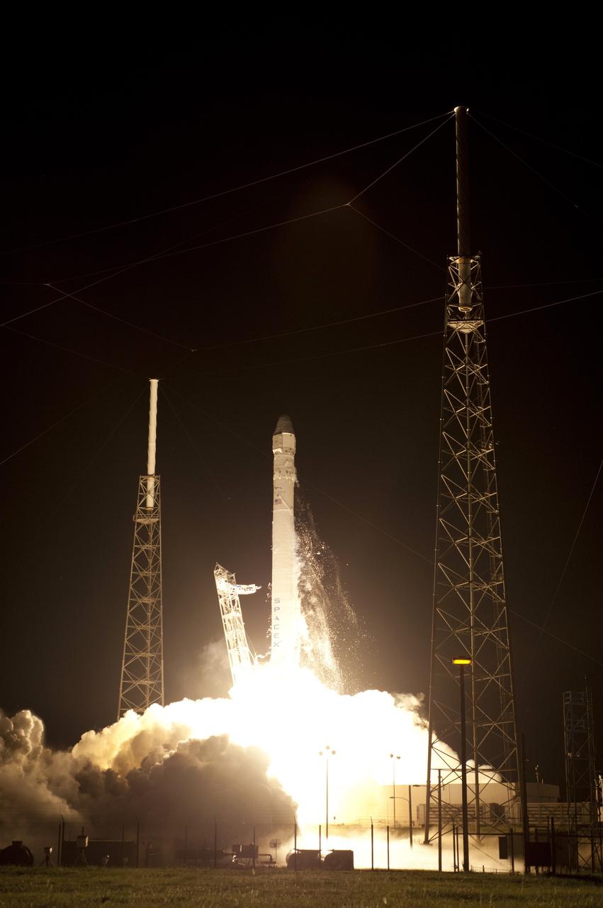 CAPE CANAVERAL, Fla. - Space Launch Complex 40 on Cape Canaveral Air Force Station in Florida comes alive as the Merlin engines ignite under the Falcon 9 rocket carrying a Dragon capsule to orbit. Liftoff was at 8:35 p.m. EDT. Space Exploration Technologies Corp., or SpaceX, built both the rocket and capsule for NASA's first Commercial Resupply Services, or CRS-1, mission to the International Space Station.    SpaceX CRS-1 is an important step toward making America’s microgravity research program self-sufficient by providing a way to deliver and return significant amounts of cargo, including science experiments, to and from the orbiting laboratory. NASA has contracted for 12 commercial resupply flights from SpaceX and eight from the Orbital Sciences Corp. For more information, visit http://www.nasa.gov/mission_pages/station/living/launch/index.html  Photo credit: NASA/Rick Wetherington and Tony Gray