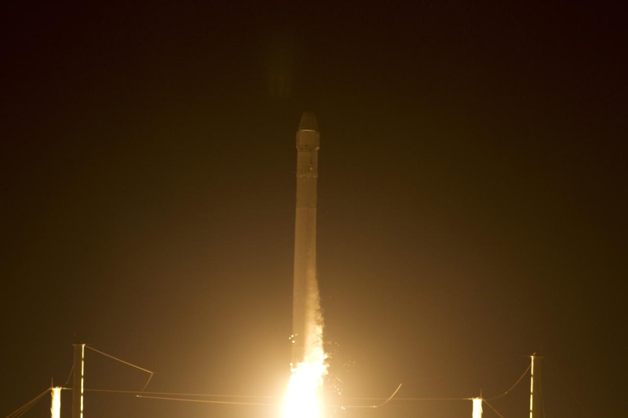 CAPE CANAVERAL, Fla. - At Space Launch Complex 40 on Cape Canaveral Air Force Station in Florida a Falcon 9 rocket carrying a Dragon capsule lifts off at 8:35 p.m. EDT. Space Exploration Technologies Corp., or SpaceX, built both the rocket and capsule for NASA's first Commercial Resupply Services, or CRS-1, mission to the International Space Station.      SpaceX CRS-1 is an important step toward making America’s microgravity research program self-sufficient by providing a way to deliver and return significant amounts of cargo, including science experiments, to and from the orbiting laboratory. NASA has contracted for 12 commercial resupply flights from SpaceX and eight from the Orbital Sciences Corp. For more information, visit http://www.nasa.gov/mission_pages/station/living/launch/index.html  Photo credit: NASA/Gina Mitchell and George Roberts