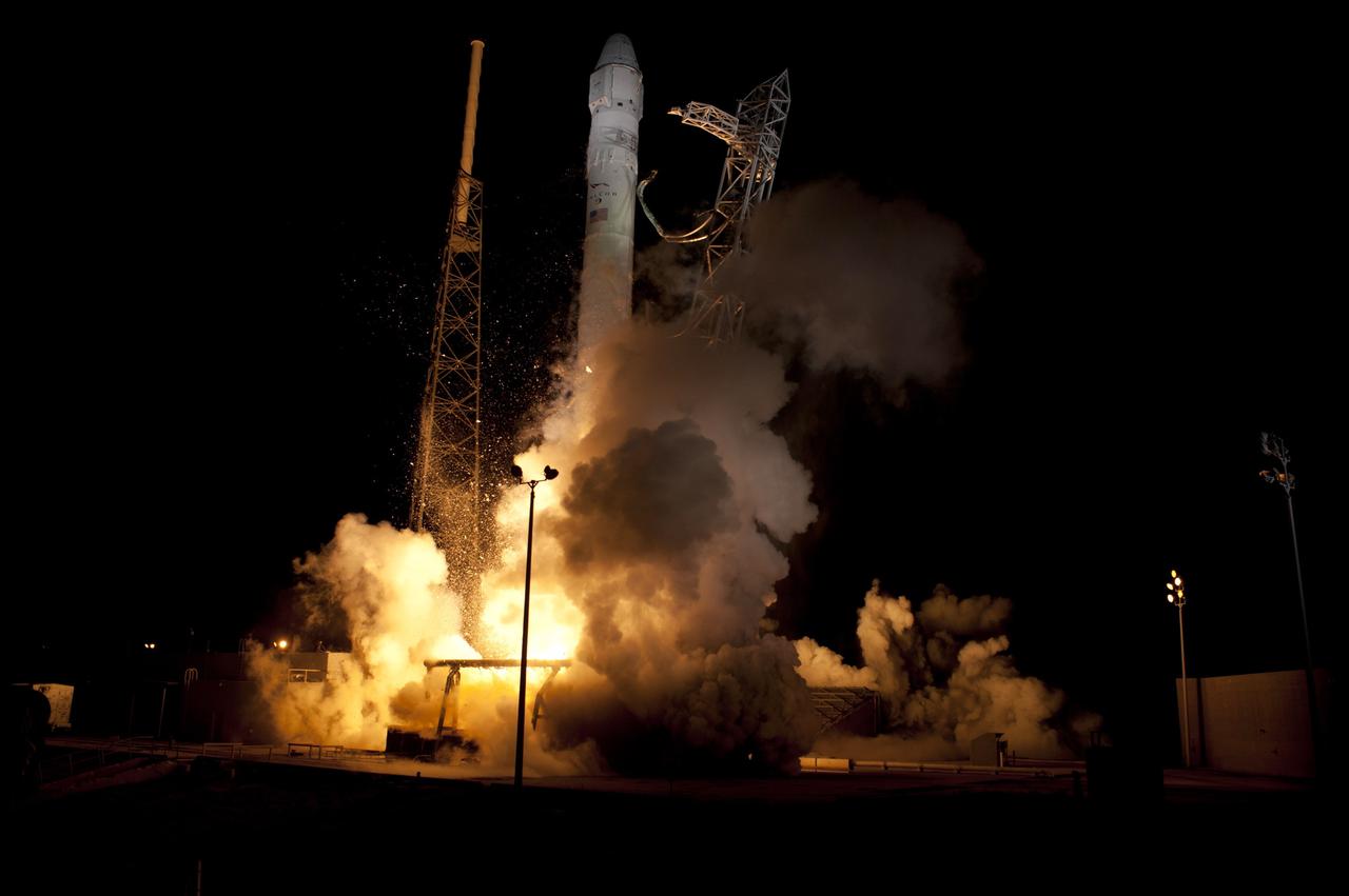 CAPE CANAVERAL, Fla. - Space Launch Complex 40 on Cape Canaveral Air Force Station in Florida comes alive as the Merlin engines ignite under the Falcon 9 rocket carrying a Dragon capsule to orbit. Liftoff was at 8:35 p.m. EDT. Space Exploration Technologies Corp., or SpaceX, built both the rocket and capsule for NASA's first Commercial Resupply Services, or CRS-1, mission to the International Space Station.      SpaceX CRS-1 is an important step toward making America’s microgravity research program self-sufficient by providing a way to deliver and return significant amounts of cargo, including science experiments, to and from the orbiting laboratory. NASA has contracted for 12 commercial resupply flights from SpaceX and eight from the Orbital Sciences Corp. For more information, visit http://www.nasa.gov/mission_pages/station/living/launch/index.html  Photo credit: NASA/ Rick Wetherington and Tim Powers