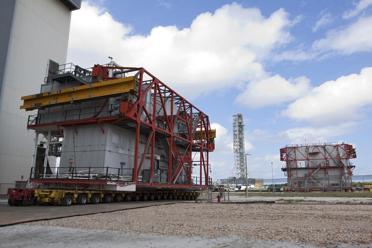 CAPE CANAVERAL, Fla. – As part of NASA's Ground Systems Development and Operations Program at the Kennedy Space Center in Florida, a large space shuttle-era work platform is being removed from high bay 3 of the Vehicle Assembly Building, or VAB, and placed on a transporter for removal. The work is part of a center-wide modernization and refurbishment initiative to accommodate NASA’s Space Launch System and a variety of other spacecraft instead of the whole building supporting one design. The Ground Systems Development and Operations Program is developing the necessary ground systems, infrastructure and operational approaches required to safely process, assemble, transport and launch the next generation of rockets and spacecraft in support of NASA’s exploration objectives. Future work also will replace the antiquated communications, power and vehicle access resources with modern efficient systems. Some of the utilities and systems slated for replacement have been used since the VAB opened in 1965. For more information, visit http://www.nasa.gov/exploration/systems/ground/index.html Photo credit: NASA/Kim Shiflett