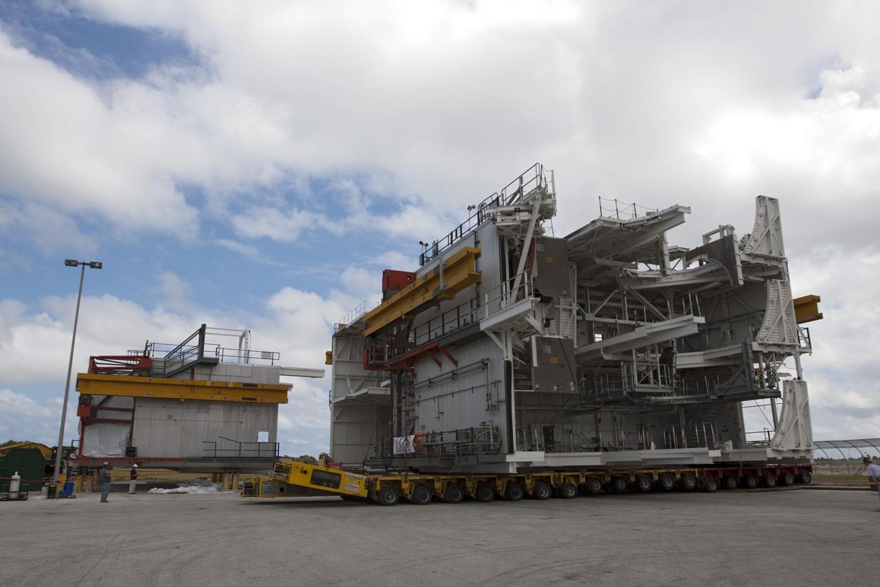 CAPE CANAVERAL, Fla. – As part of NASA's Ground Systems Development and Operations Program at the Kennedy Space Center in Florida, a large space shuttle-era work platform is being removed from high bay 3 of the Vehicle Assembly Building, or VAB, and placed on a transporter for removal. The work is part of a center-wide modernization and refurbishment initiative to accommodate NASA’s Space Launch System and a variety of other spacecraft instead of the whole building supporting one design. The Ground Systems Development and Operations Program is developing the necessary ground systems, infrastructure and operational approaches required to safely process, assemble, transport and launch the next generation of rockets and spacecraft in support of NASA’s exploration objectives. Future work also will replace the antiquated communications, power and vehicle access resources with modern efficient systems. Some of the utilities and systems slated for replacement have been used since the VAB opened in 1965. For more information, visit http://www.nasa.gov/exploration/systems/ground/index.html Photo credit: NASA/Kim Shiflett