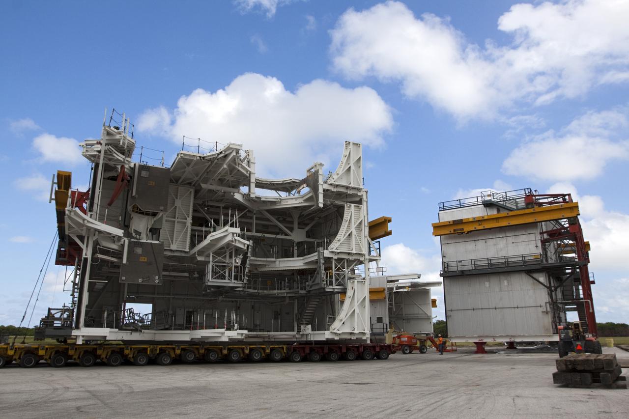 CAPE CANAVERAL, Fla. – As part of NASA's Ground Systems Development and Operations Program at the Kennedy Space Center in Florida, a large space shuttle-era work platform is being removed from high bay 3 of the Vehicle Assembly Building, or VAB, and placed on a transporter for removal. The work is part of a center-wide modernization and refurbishment initiative to accommodate NASA’s Space Launch System and a variety of other spacecraft instead of the whole building supporting one design. The Ground Systems Development and Operations Program is developing the necessary ground systems, infrastructure and operational approaches required to safely process, assemble, transport and launch the next generation of rockets and spacecraft in support of NASA’s exploration objectives. Future work also will replace the antiquated communications, power and vehicle access resources with modern efficient systems. Some of the utilities and systems slated for replacement have been used since the VAB opened in 1965. For more information, visit http://www.nasa.gov/exploration/systems/ground/index.html Photo credit: NASA/Kim Shiflett