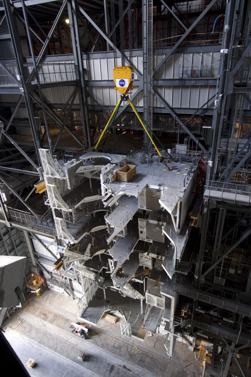 CAPE CANAVERAL, Fla. – As part of NASA's Ground Systems Development and Operations Program at the Kennedy Space Center in Florida, a large space shuttle-era work platform is being removed from high bay 3 of the Vehicle Assembly Building, or VAB. The work is part of a center-wide modernization and refurbishment initiative to accommodate NASA’s Space Launch System and a variety of other spacecraft instead of the whole building supporting one design. The Ground Systems Development and Operations Program is developing the necessary ground systems, infrastructure and operational approaches required to safely process, assemble, transport and launch the next generation of rockets and spacecraft in support of NASA’s exploration objectives. Future work also will replace the antiquated communications, power and vehicle access resources with modern efficient systems. Some of the utilities and systems slated for replacement have been used since the VAB opened in 1965. For more information, visit http://www.nasa.gov/exploration/systems/ground/index.html Photo credit: NASA/Jim Grossmann