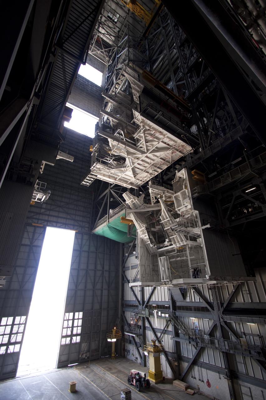 CAPE CANAVERAL, Fla. – As part of NASA's Ground Systems Development and Operations Program at the Kennedy Space Center in Florida, a large space shuttle-era work platform is being removed from high bay 3 of the Vehicle Assembly Building, or VAB. The work is part of a center-wide modernization and refurbishment initiative to accommodate NASA’s Space Launch System and a variety of other spacecraft instead of the whole building supporting one design. The Ground Systems Development and Operations Program is developing the necessary ground systems, infrastructure and operational approaches required to safely process, assemble, transport and launch the next generation of rockets and spacecraft in support of NASA’s exploration objectives. Future work also will replace the antiquated communications, power and vehicle access resources with modern efficient systems. Some of the utilities and systems slated for replacement have been used since the VAB opened in 1965. For more information, visit http://www.nasa.gov/exploration/systems/ground/index.html Photo credit: NASA/Jim Grossmann