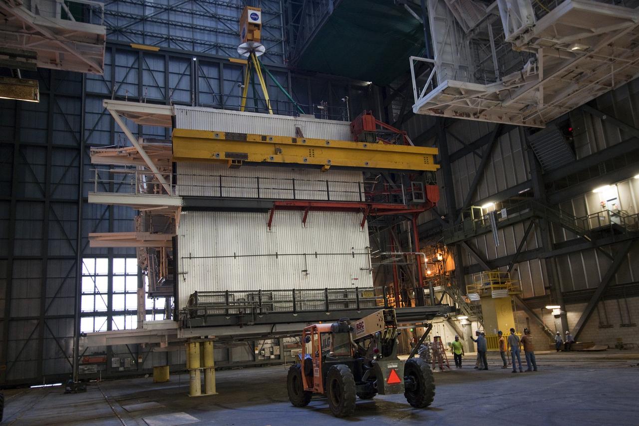 CAPE CANAVERAL, Fla. – As part of NASA's Ground Systems Development and Operations Program at the Kennedy Space Center in Florida, a large space shuttle-era work platform is being removed from high bay 3 of the Vehicle Assembly Building, or VAB. The work is part of a center-wide modernization and refurbishment initiative to accommodate NASA’s Space Launch System and a variety of other spacecraft instead of the whole building supporting one design. The Ground Systems Development and Operations Program is developing the necessary ground systems, infrastructure and operational approaches required to safely process, assemble, transport and launch the next generation of rockets and spacecraft in support of NASA’s exploration objectives. Future work also will replace the antiquated communications, power and vehicle access resources with modern efficient systems. Some of the utilities and systems slated for replacement have been used since the VAB opened in 1965. For more information, visit http://www.nasa.gov/exploration/systems/ground/index.html Photo credit: NASA/Jim Grossmann