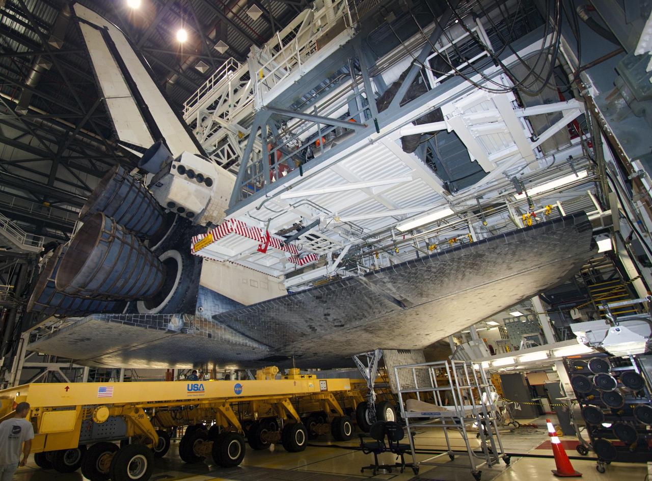 CAPE CANAVERAL, Fla. – Space shuttle Atlantis is loaded onto the orbiter transporter vehicle in Orbiter Processing Facility-2 at NASA's Kennedy Space Center in Florida. The shuttle is being prepared for its move from the OPF to the Vehicle Assembly Building during transition and retirement work. Later, the shuttle will be taken to the Kennedy Space Center Visitor Complex where it will go on public display. Photo credit: NASA/Jim Grossmann