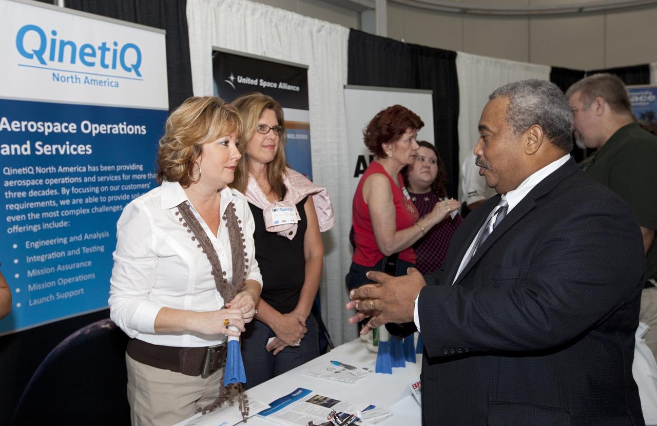 PORT CANAVERAL, Fla. – NASA Associate Administrator for the Office of Small Business Programs Glenn Delgado, right, speaks with exhibitors participating NASA's Historically Underutilized Business Zone, or HUBZone, Industry Day and Expo 2012 on Oct. 16. Exhibitors included vendors from product and service areas, such as engineering services, computer technology, communication equipment and services, and construction and safety products.      The event was hosted for business leaders who are interested in learning about government contracting opportunities and what local and national vendors have to offer. The expo was held in Cruise Terminal 4 at Port Canaveral, Fla. The annual trade show is sponsored by Kennedy's Prime Contractor Board, the U.S. Air Force 45th Space Wing and the Canaveral Port Authority. It featured about 175 large and small businesses and government exhibitors from Brevard County and across the nation. Photo credit: NASA/ Kim Shiflett