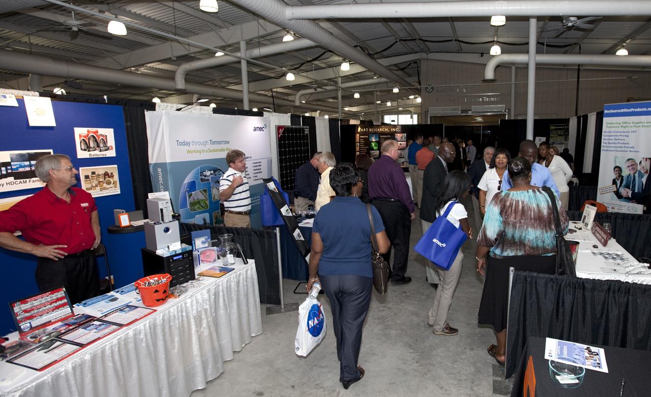 PORT CANAVERAL, Fla. – Local business representatives attended NASA's Historically Underutilized Business Zone, or HUBZone, Industry Day and Expo 2012 on Oct. 16. Exhibitors included vendors from product and service areas, such as engineering services, computer technology, communication equipment and services, and construction and safety products.      The event was hosted for business leaders who are interested in learning about government contracting opportunities and what local and national vendors have to offer. The expo was held in Cruise Terminal 4 at Port Canaveral, Fla. The annual trade show is sponsored by Kennedy's Prime Contractor Board, the U.S. Air Force 45th Space Wing and the Canaveral Port Authority. It featured about 175 large and small businesses and government exhibitors from Brevard County and across the nation. Photo credit: NASA/ Kim Shiflett