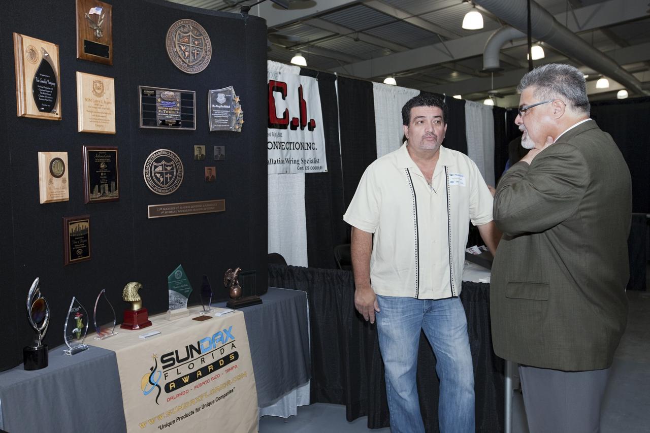 PORT CANAVERAL, Fla. – Local business representatives attended NASA's Historically Underutilized Business Zone, or HUBZone, Industry Day and Expo 2012 on Oct. 16. Exhibitors included vendors from product and service areas, such as engineering services, computer technology, communication equipment and services, and construction and safety products.      The event was hosted for business leaders who are interested in learning about government contracting opportunities and what local and national vendors have to offer. The expo was held in Cruise Terminal 4 at Port Canaveral, Fla. The annual trade show is sponsored by Kennedy's Prime Contractor Board, the U.S. Air Force 45th Space Wing and the Canaveral Port Authority. It featured about 175 large and small businesses and government exhibitors from Brevard County and across the nation. Photo credit: NASA/ Kim Shiflett