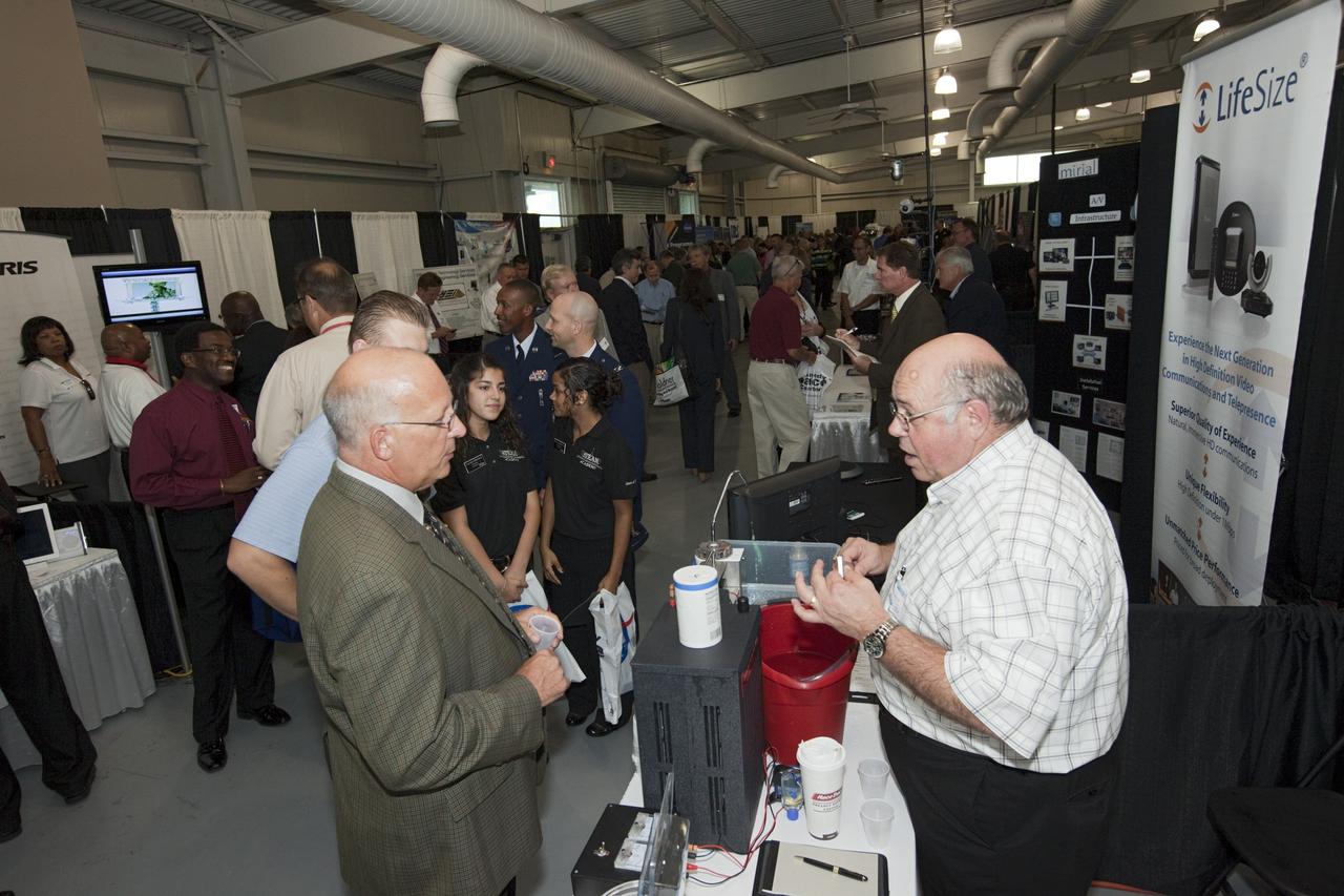 PORT CANAVERAL, Fla. – Local business representatives attended NASA's Historically Underutilized Business Zone, or HUBZone, Industry Day and Expo 2012 on Oct. 16. Exhibitors included vendors from product and service areas, such as engineering services, computer technology, communication equipment and services, and construction and safety products.      The event was hosted for business leaders who are interested in learning about government contracting opportunities and what local and national vendors have to offer. The expo was held in Cruise Terminal 4 at Port Canaveral, Fla. The annual trade show is sponsored by Kennedy's Prime Contractor Board, the U.S. Air Force 45th Space Wing and the Canaveral Port Authority. It featured about 175 large and small businesses and government exhibitors from Brevard County and across the nation. Photo credit: NASA/ Kim Shiflett