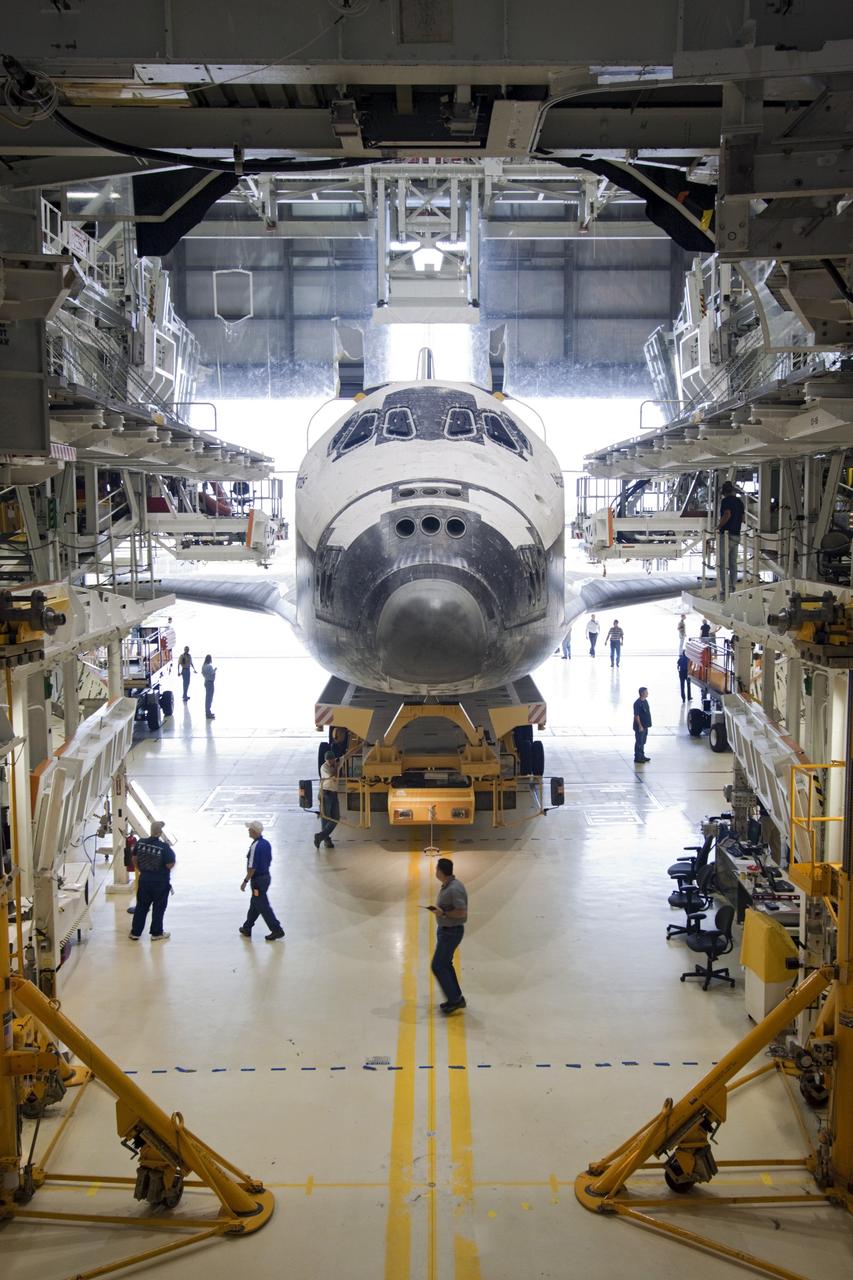 CAPE CANAVERAL, Fla. – Technicians watch as space shuttle Atlantis moves from Orbiter Processing Facility-2 to the Vehicle Assembly Building at NASA's Kennedy Space Center in Florida. Atlantis will be moved to the Kennedy Space Center Visitor Complex in November where it will be put on public display. Photo credit: NASA/Jim Grossmann