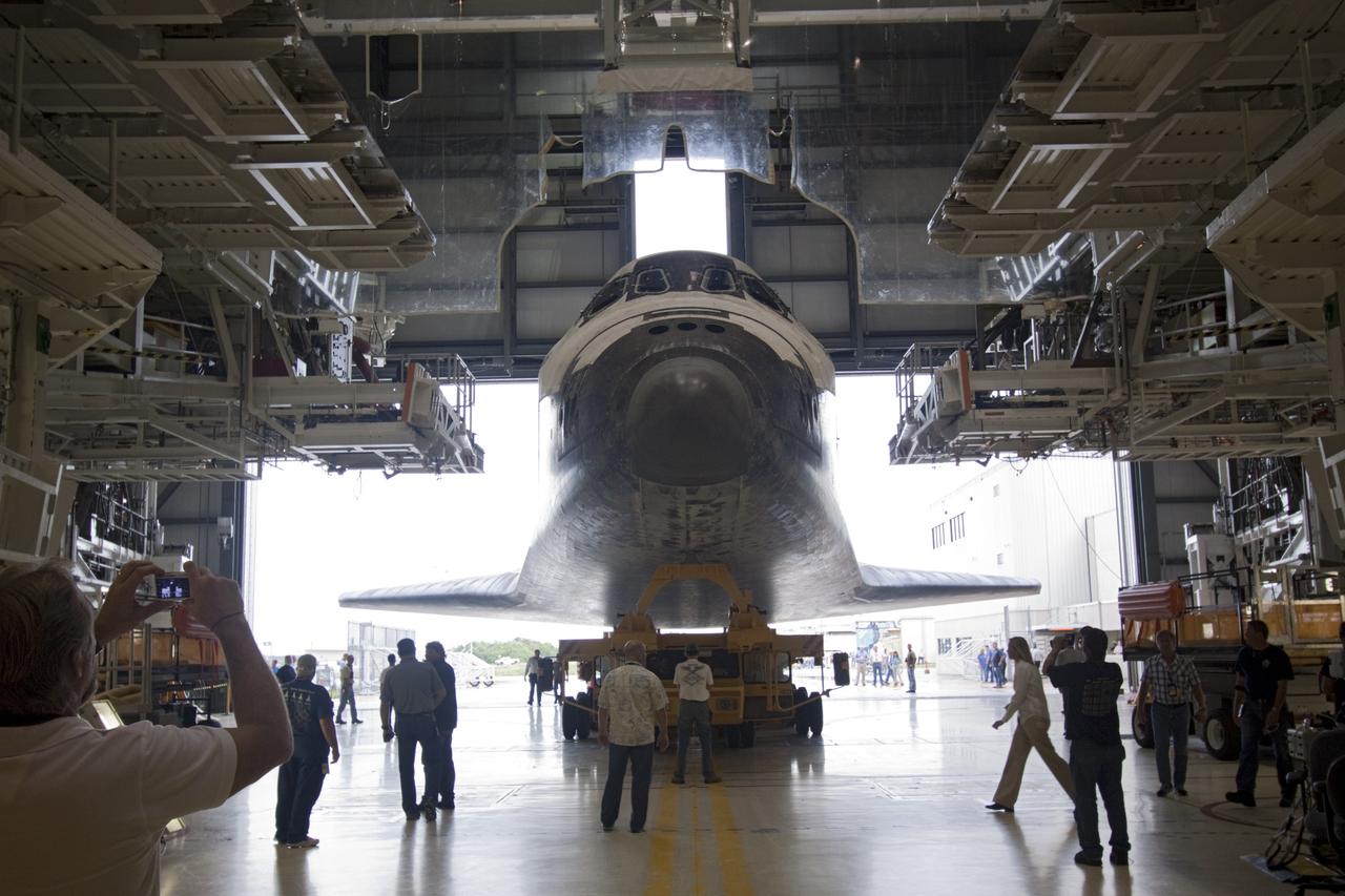 CAPE CANAVERAL, Fla. – Technicians watch as space shuttle Atlantis moves from Orbiter Processing Facility-2 to the Vehicle Assembly Building at NASA's Kennedy Space Center in Florida. Atlantis will be moved to the Kennedy Space Center Visitor Complex in November where it will be put on public display. Photo credit: NASA/Jim Grossmann