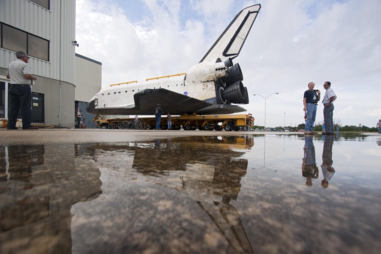 CAPE CANAVERAL, Fla. – Technicians watch as space shuttle Atlantis moves from Orbiter Processing Facility-2 to the Vehicle Assembly Building at NASA's Kennedy Space Center in Florida. Atlantis will be moved to the Kennedy Space Center Visitor Complex in November where it will be put on public display. Photo credit: NASA/Jim Grossmann