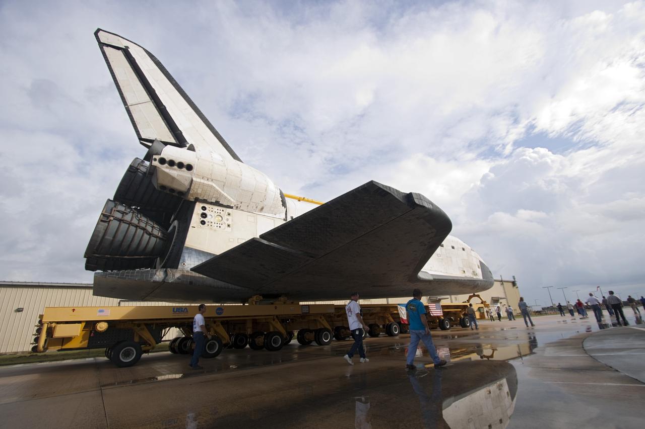 CAPE CANAVERAL, Fla. – Technicians watch as space shuttle Atlantis moves from Orbiter Processing Facility-2 to the Vehicle Assembly Building at NASA's Kennedy Space Center in Florida. Atlantis will be moved to the Kennedy Space Center Visitor Complex in November where it will be put on public display. Photo credit: NASA/Jim Grossmann