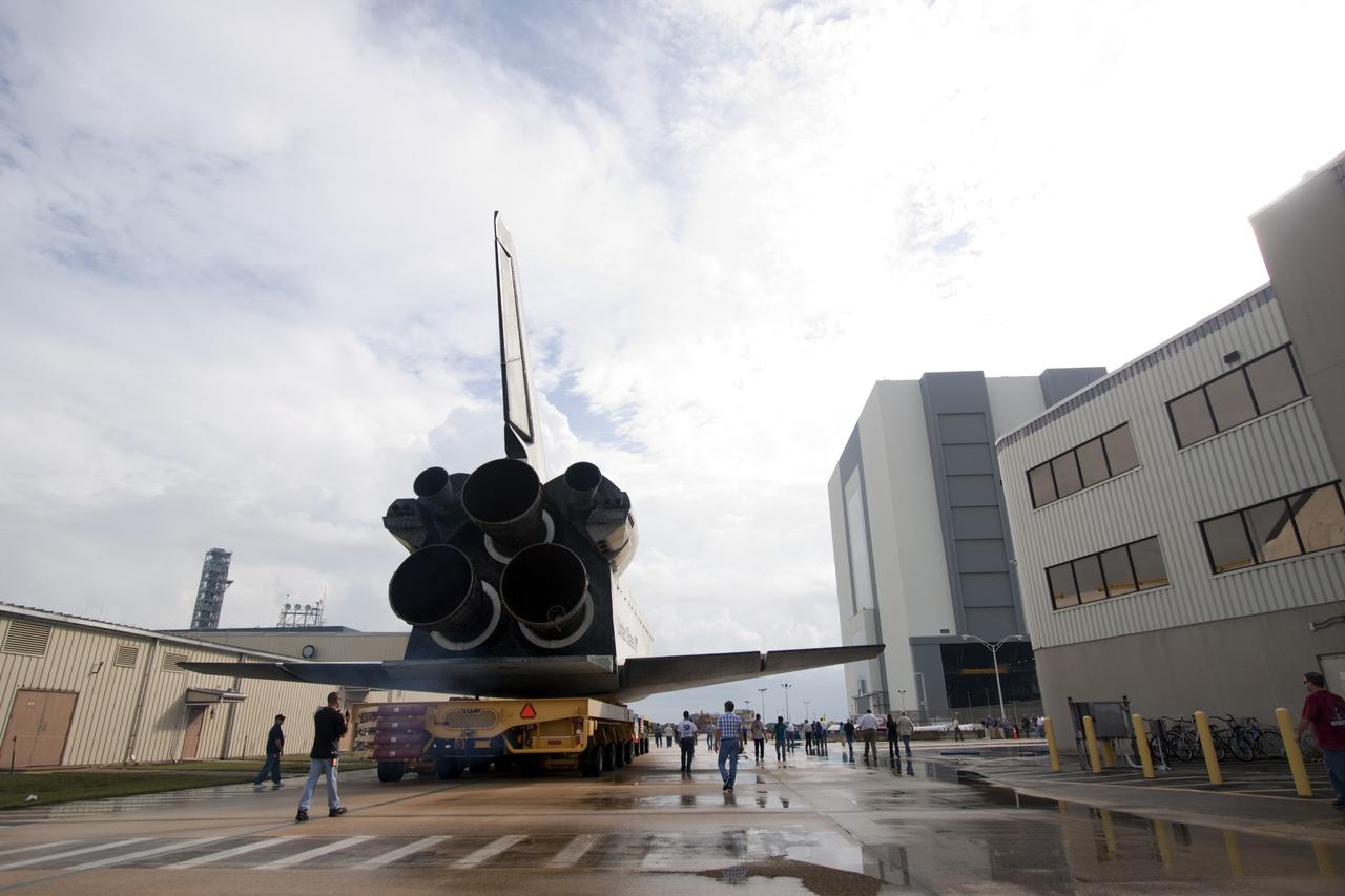 CAPE CANAVERAL, Fla. – Technicians watch as space shuttle Atlantis moves from Orbiter Processing Facility-2 to the Vehicle Assembly Building at NASA's Kennedy Space Center in Florida. Atlantis will be moved to the Kennedy Space Center Visitor Complex in November where it will be put on public display. Photo credit: NASA/Jim Grossmann