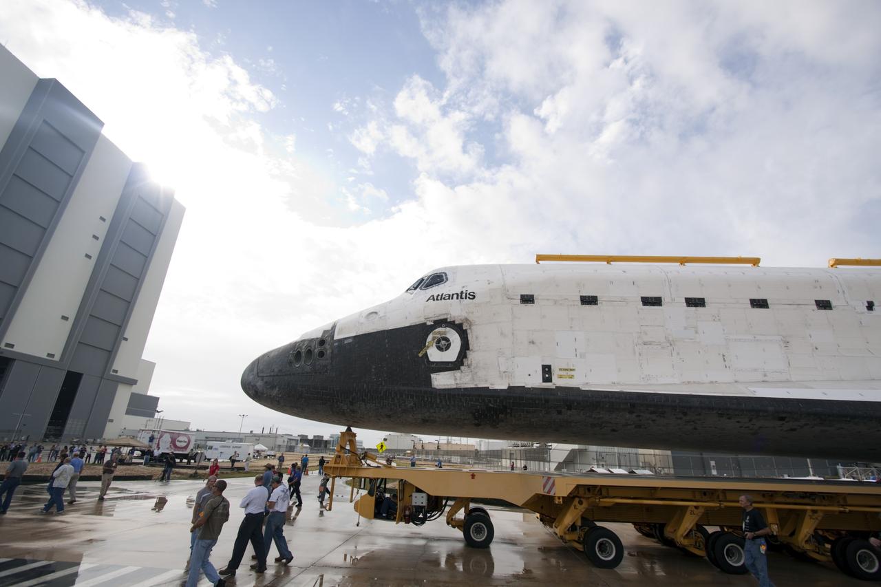 CAPE CANAVERAL, Fla. – Technicians watch as space shuttle Atlantis moves from Orbiter Processing Facility-2 to the Vehicle Assembly Building at NASA's Kennedy Space Center in Florida. Atlantis will be moved to the Kennedy Space Center Visitor Complex in November where it will be put on public display. Photo credit: NASA/Jim Grossmann