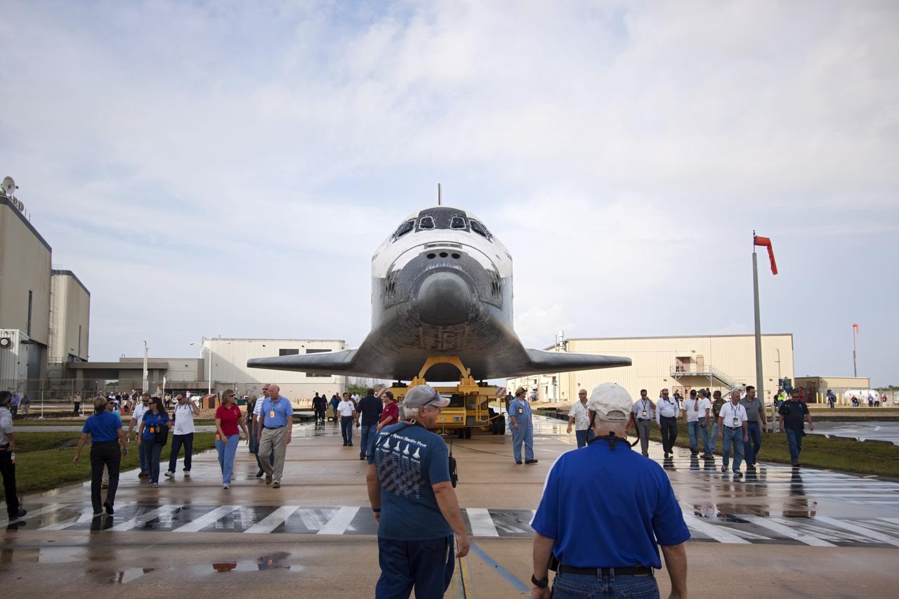 CAPE CANAVERAL, Fla. -- Technicians watch as space shuttle Atlantis moves from Orbiter Processing Facility-2 to the Vehicle Assembly Building at NASA's Kennedy Space Center in Florida. Atlantis will be moved to the Kennedy Space Center Visitor Complex in November where it will be put on public display. Photo credit: NASA/Jim Grossmann