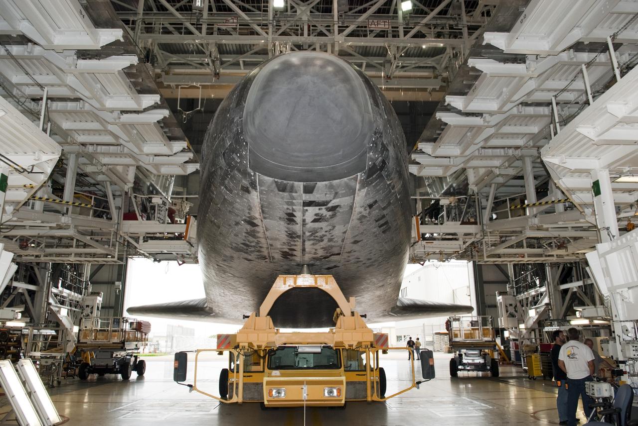 CAPE CANAVERAL, Fla. -- Technicians watch as space shuttle Atlantis moves from Orbiter Processing Facility-2 to the Vehicle Assembly Building at NASA's Kennedy Space Center in Florida. Atlantis will be moved to the Kennedy Space Center Visitor Complex in November where it will be put on public display. Photo credit: NASA/Tim Jacobs
