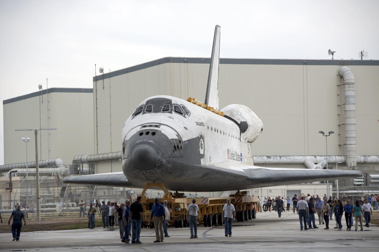 CAPE CANAVERAL, Fla. – Employees at NASA's Kennedy Space Center in Florida monitor the space shuttle Atlantis as it moves from Orbiter Processing Facility-2 to the Vehicle Assembly Building. Atlantis will be moved to the Kennedy Space Center Visitor Complex in November where it will be placed on public display. Photo credit: NASA/Jim Grossmann