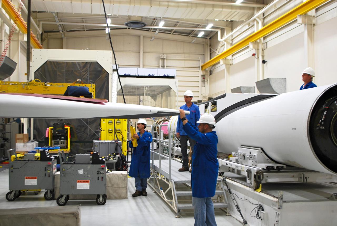VANDENBERG AIR FORCE BASE, Calif. – At Vandenberg Air Force Base in California, technicians prepare to install the wing on the Orbital Sciences Corp. Pegasus XL rocket which will launch the Interface Region Imaging Spectrograph, or IRIS, spacecraft.      Scheduled for launch from Vandenberg Air Force Base no earlier than Feb. 27, 2013, IRIS will open a new window of discovery by tracing the flow of energy and plasma through the chromospheres and transition region into the sun’s corona using spectrometry and imaging. IRIS fills a crucial gap in our ability to advance studies of the sun-to-Earth connection by tracing the flow of energy and plasma through the foundation of the corona and the region around the sun known as the heliosphere. For more information, visit http://iris.gsfc.nasa.gov Photo credit: NASA/Randy Beaudoin